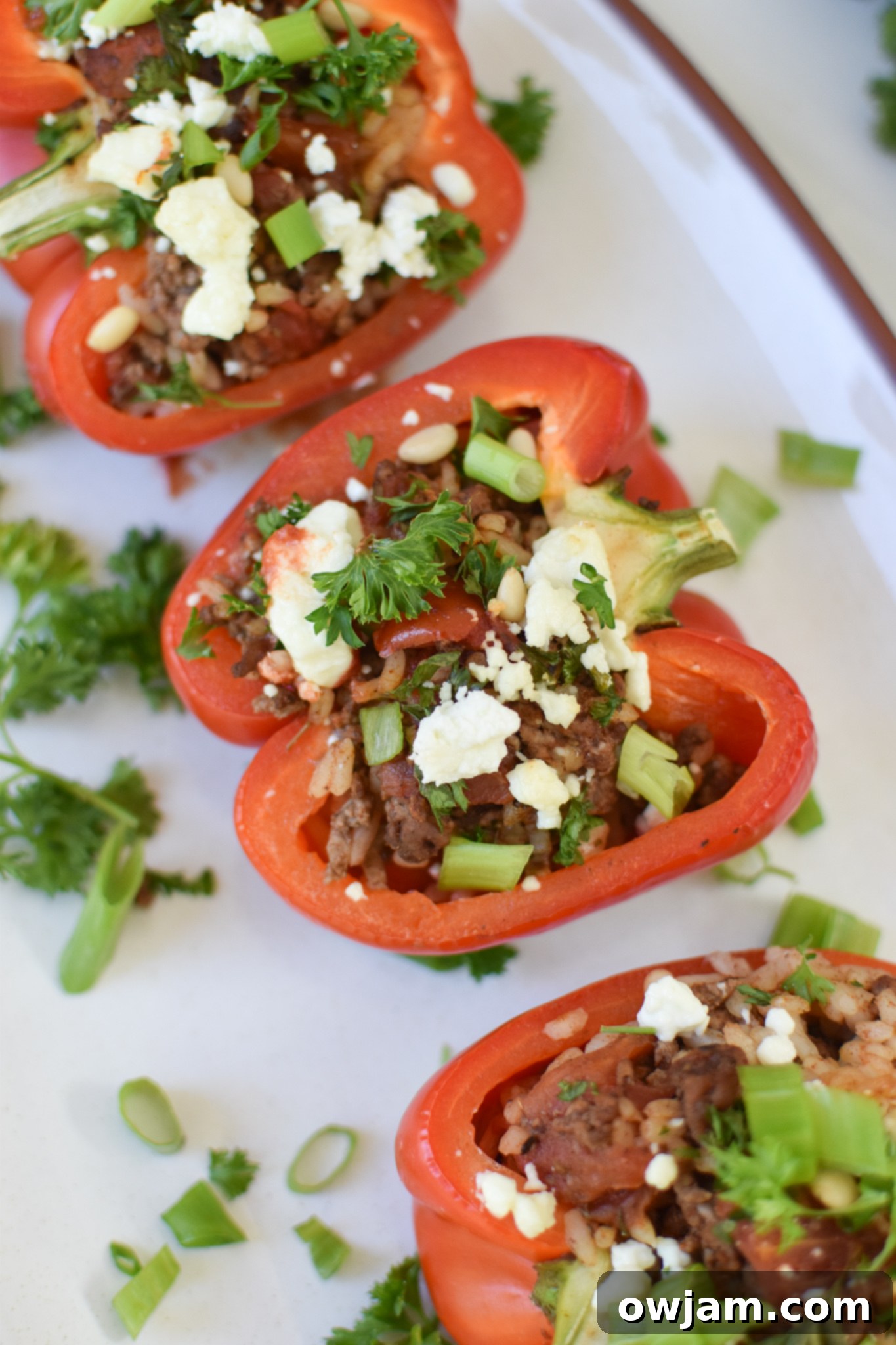 Mediterranean Ground Beef Stuffed Peppers on a white platter.