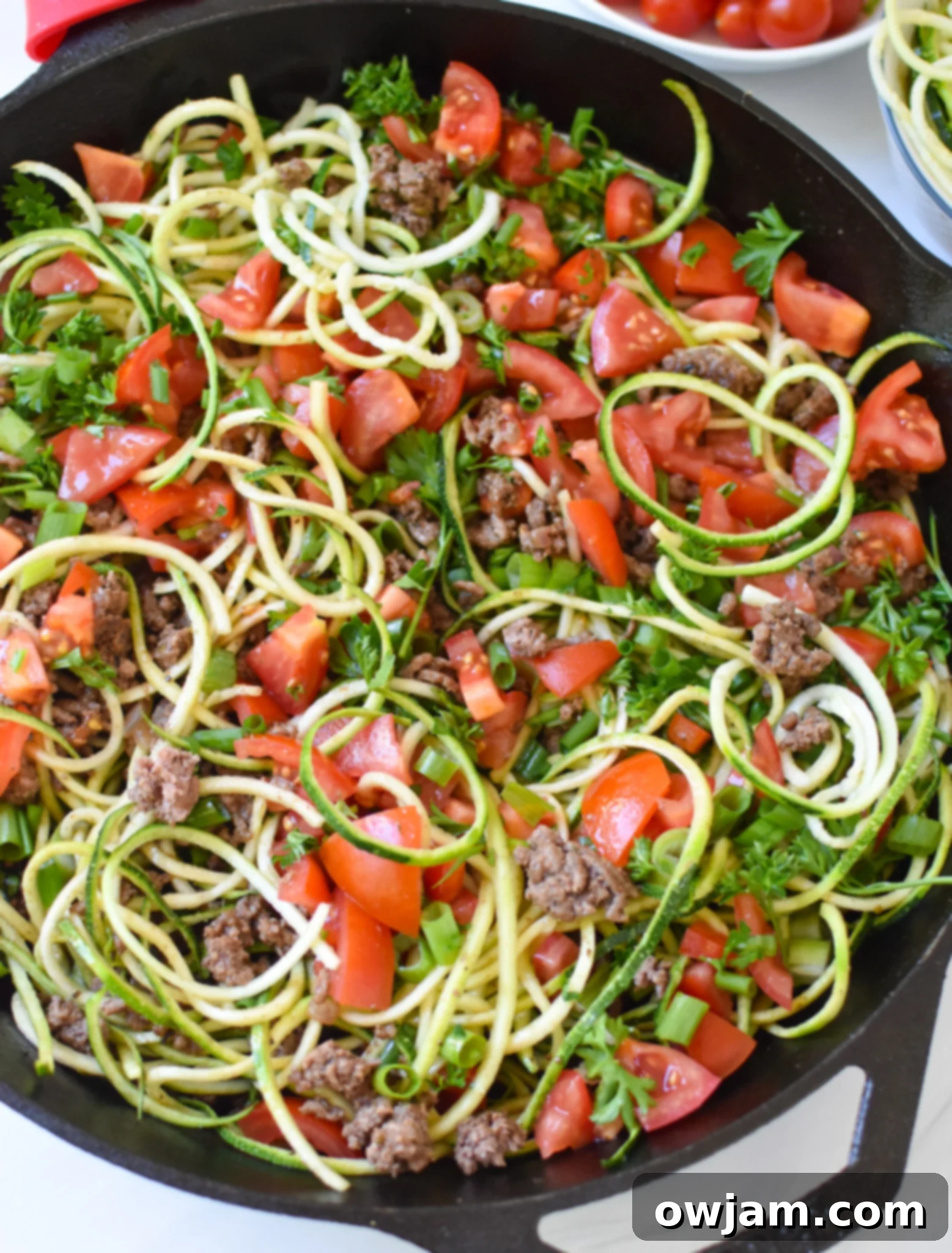 Ground Beef Zucchini Skillet with zucchini noodles in a close up view.