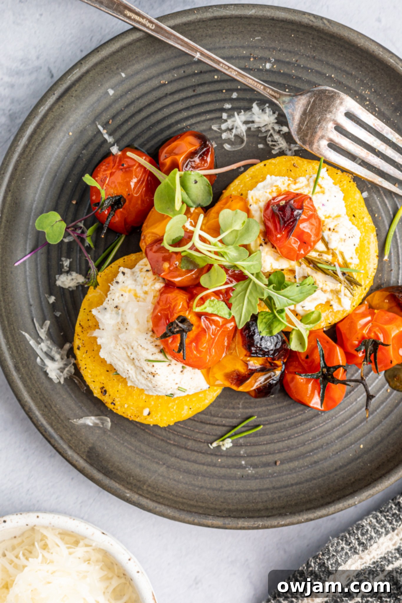 Golden Polenta Towers 4 Crispy Polenta Stacks with tomatoes.