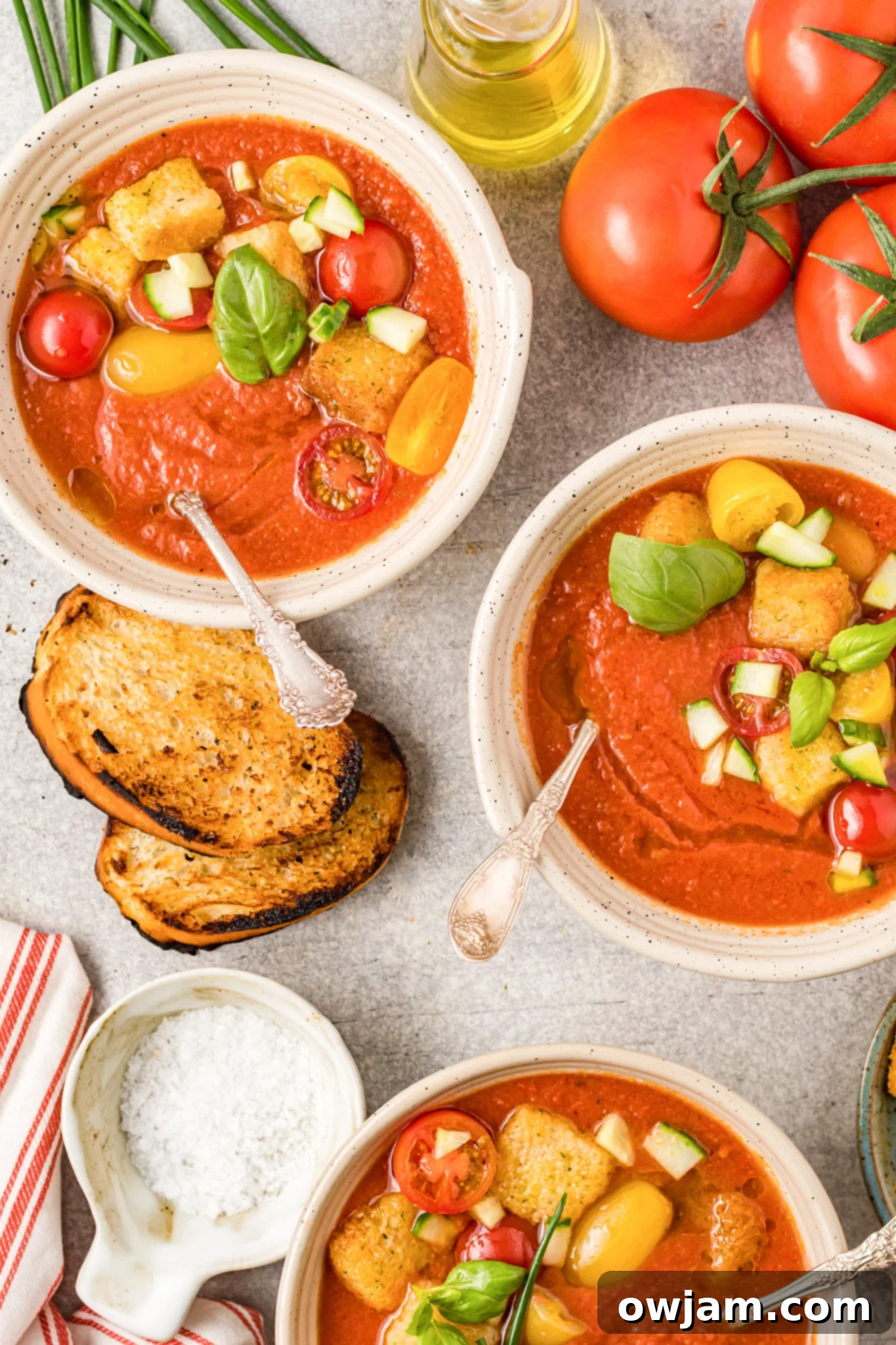 Easy Gazpacho Recipe bowls of soup garnished.