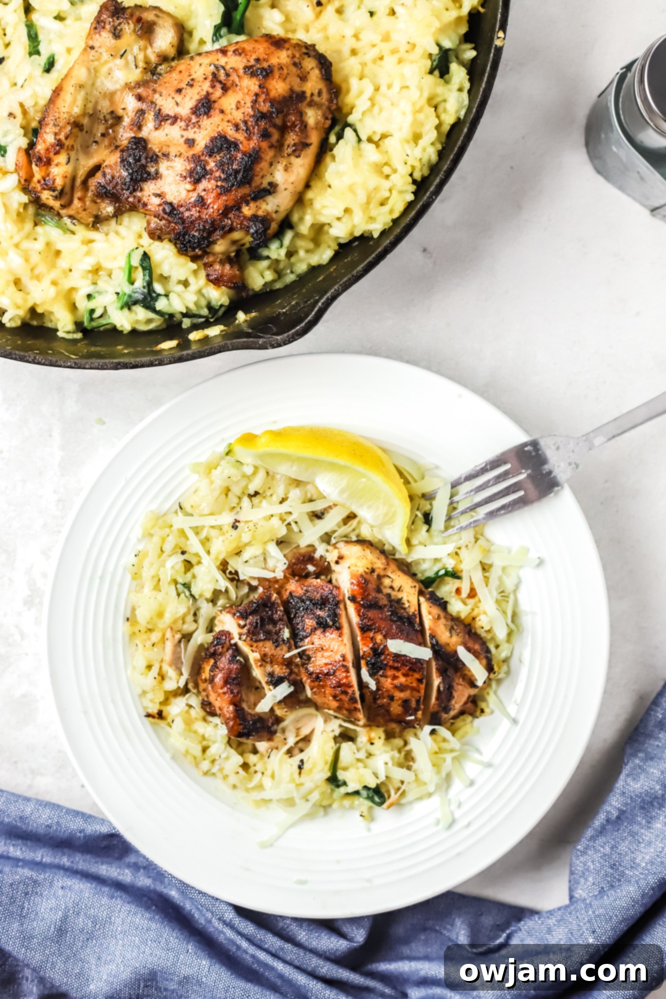Oven Baked Chicken Thighs with Risotto with fork. 