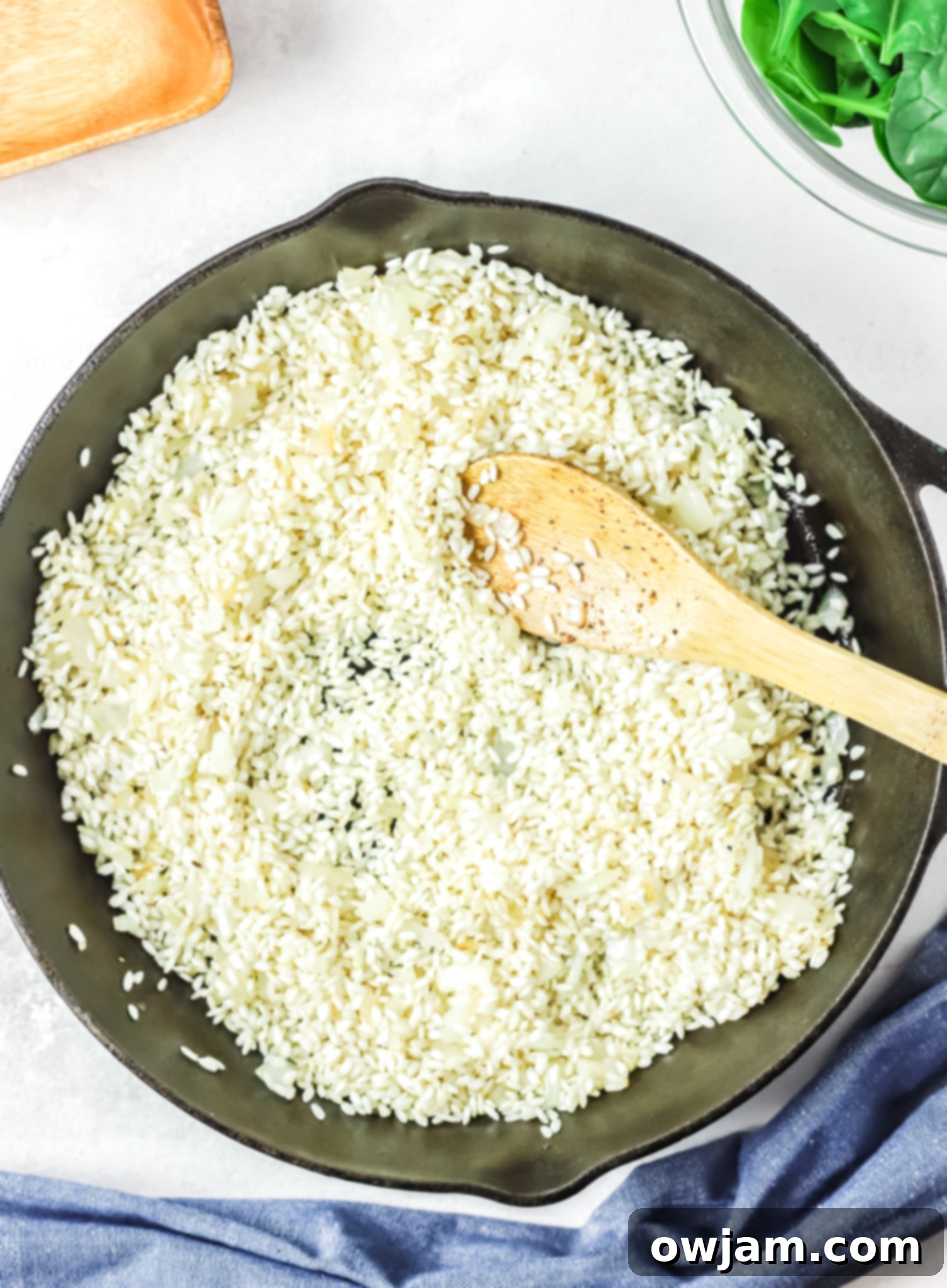 Oven Baked Chicken Thighs with Risotto risotto in a skillet. 