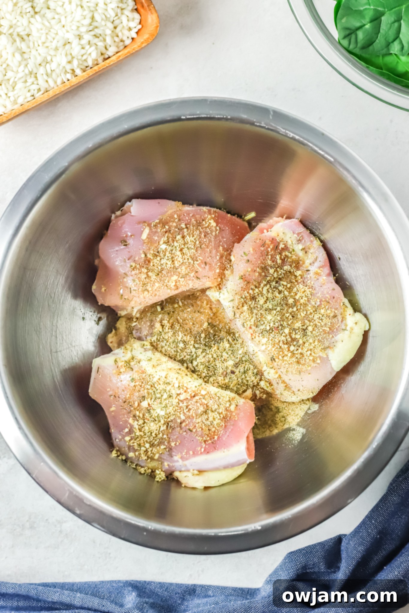 Oven Baked Chicken Thighs with Risotto chicken with seasonings. 