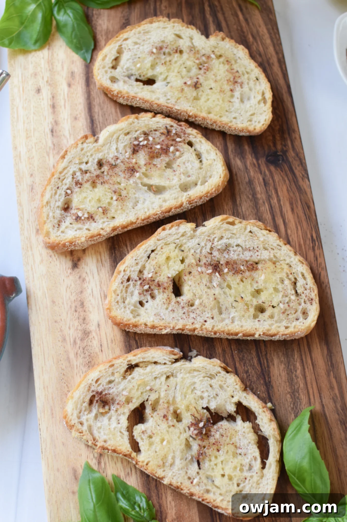 Creamy Feta Tomato Toast 5 Tomato Toast with Whipped Feta broaden a cutting board.