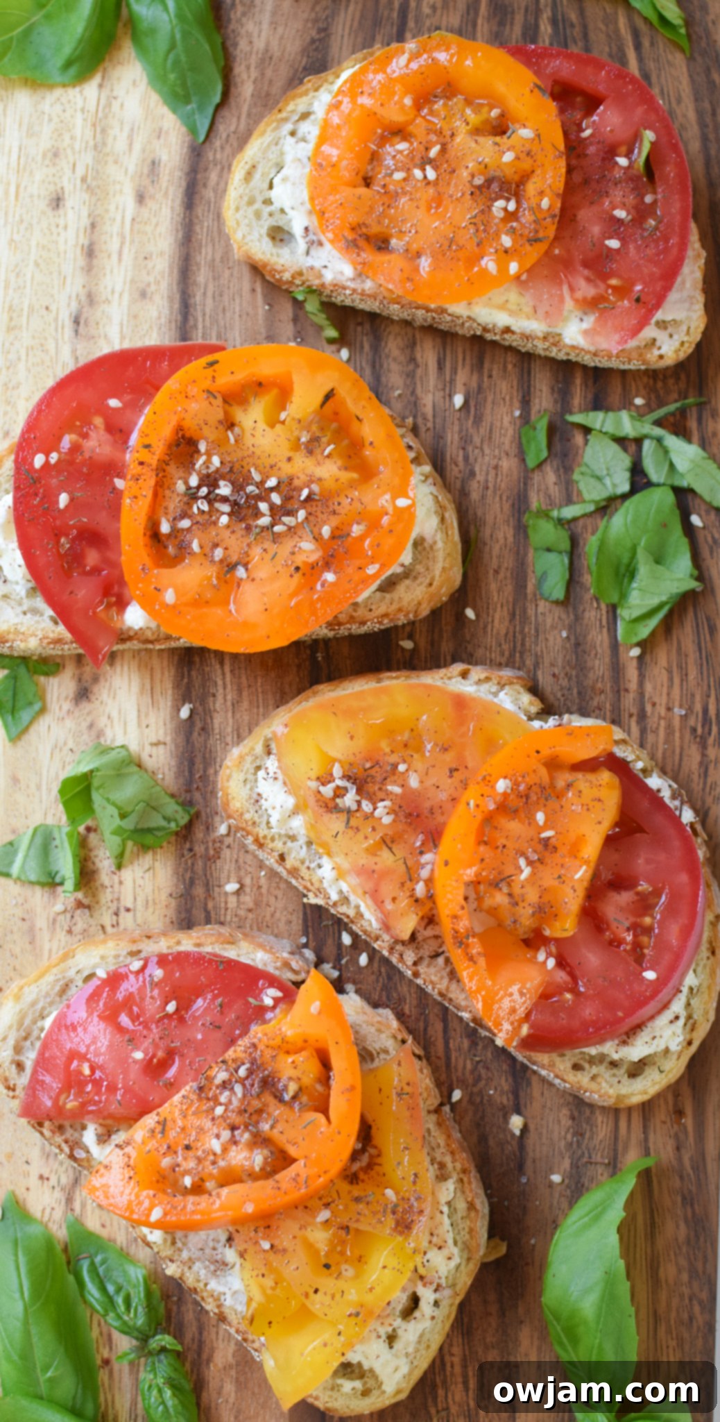 Creamy Feta Tomato Toast 7 Tomato Toast with Whipped Feta toast on a cutting board.