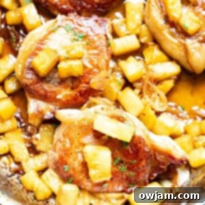 Sweet and Savory Pineapple Pork Chops 10 Easy Pineapple Pork Chops in a skillet, ready to be served.