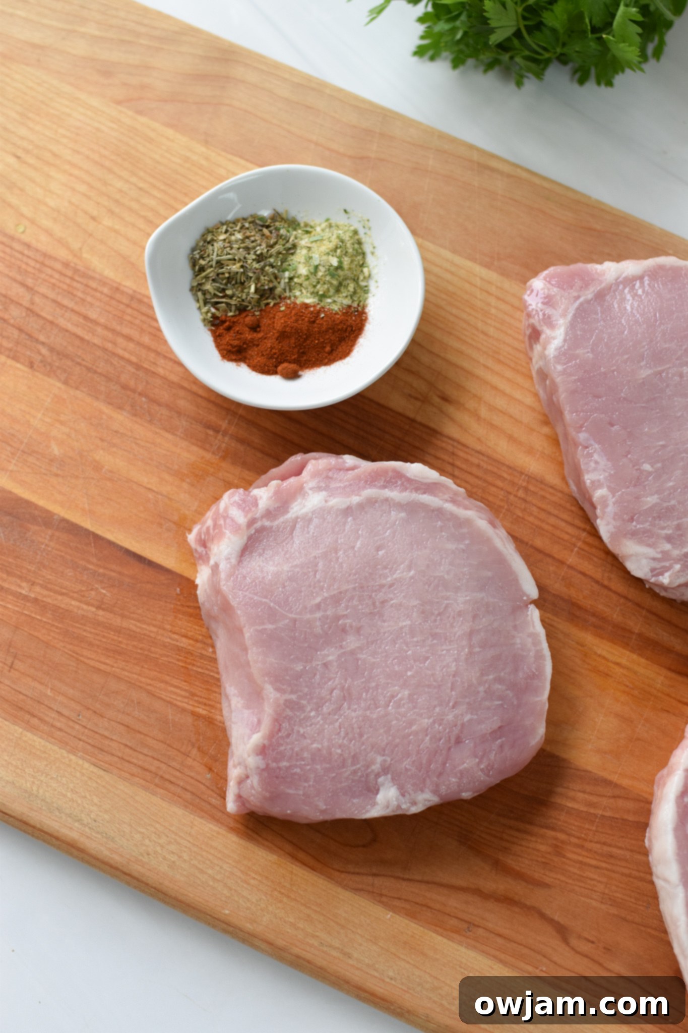 Air Fryer Boneless Pork Chops on a cutting board. 