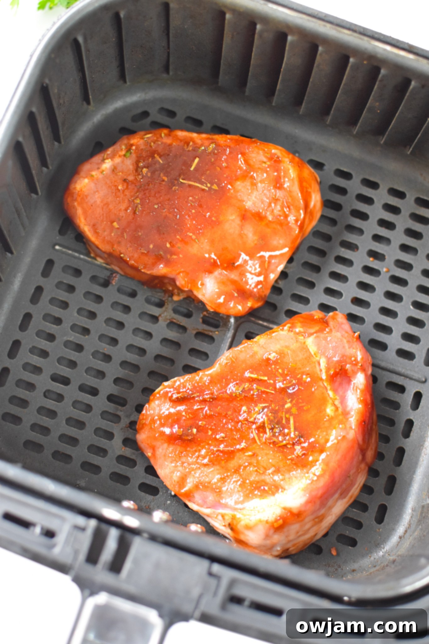 Air Fryer Boneless Pork Chops in the air fryer. 