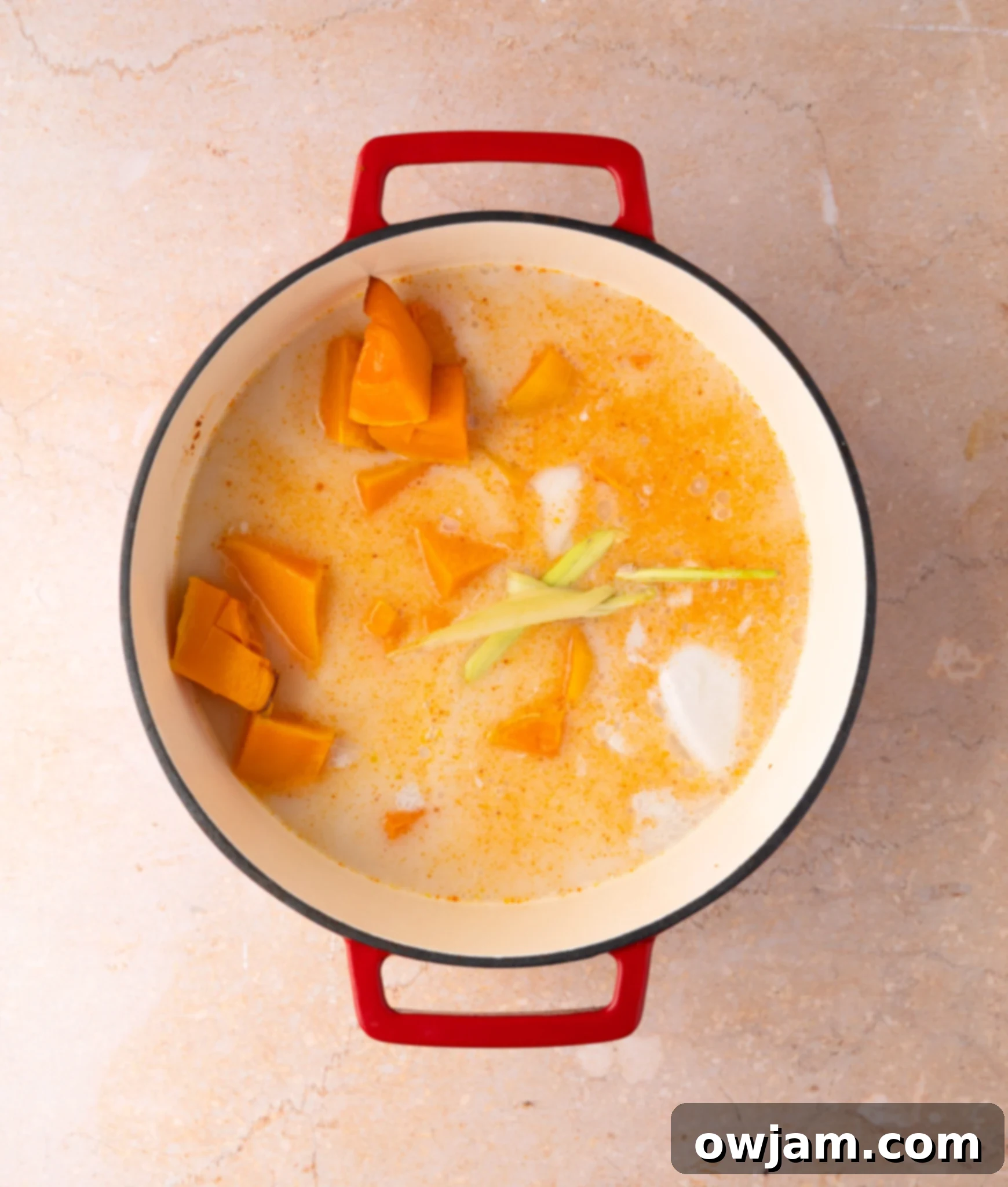 Autumn Ember Pumpkin Soup 8 Close-up of creamy Thai Roasted Pumpkin Soup in a pot after blending, ready to be served.