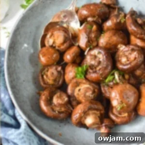 Flavorful Balsamic Roasted Mushrooms 9 Balsamic Roasted Mushrooms, garnished with fresh herbs in a square image thumbnail.