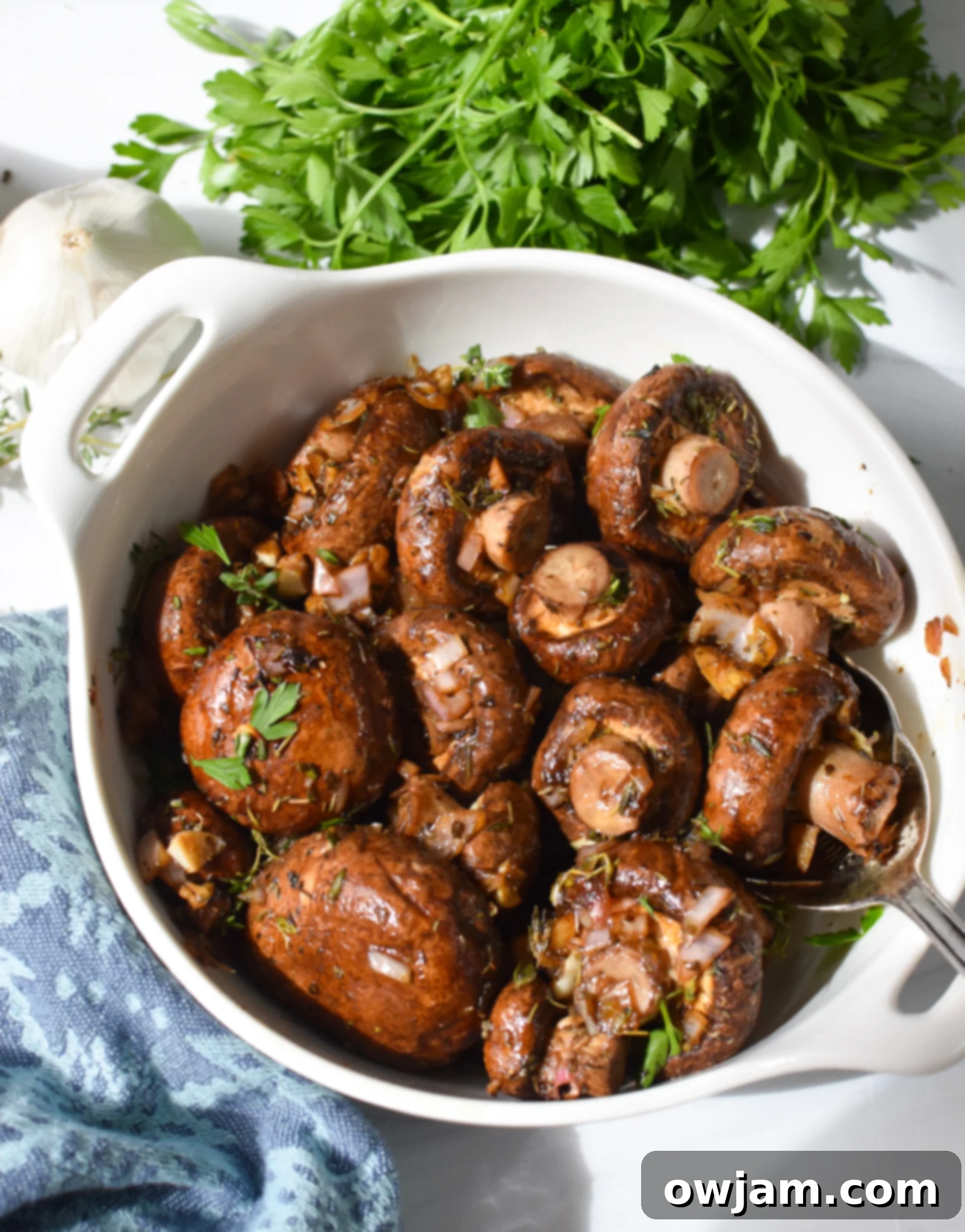 Flavorful Balsamic Roasted Mushrooms 4 Close-up of roasted balsamic mushrooms in a white serving bowl, ready to be enjoyed.