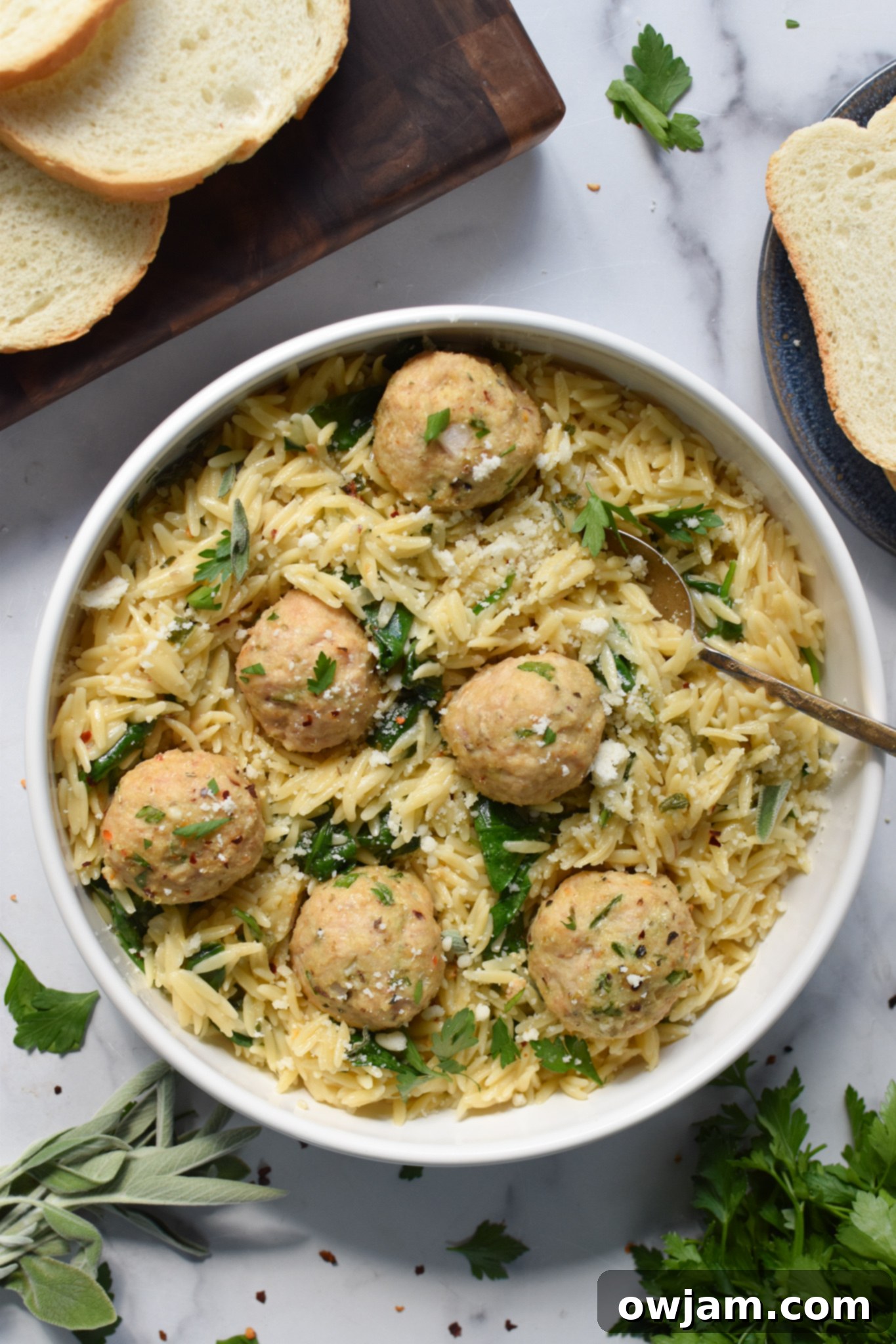 Golden Baked Chicken Bites 8 Baked Chicken Meatballs in a bowl with a fork.