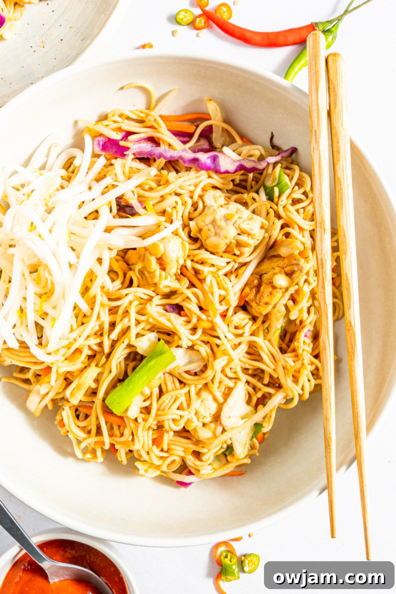 Quick Veggie Chow Mein 4 Easy Vegetable Chow Mein in a bowl, ready to be eaten with chopsticks.