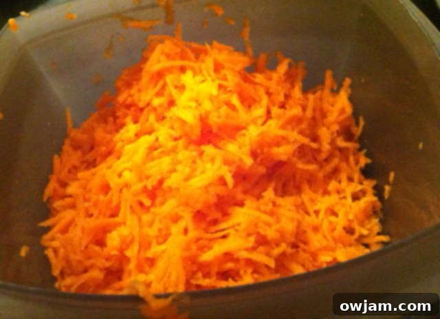 Freshly shredded carrots, an essential ingredient for moist and flavorful carrot cupcakes