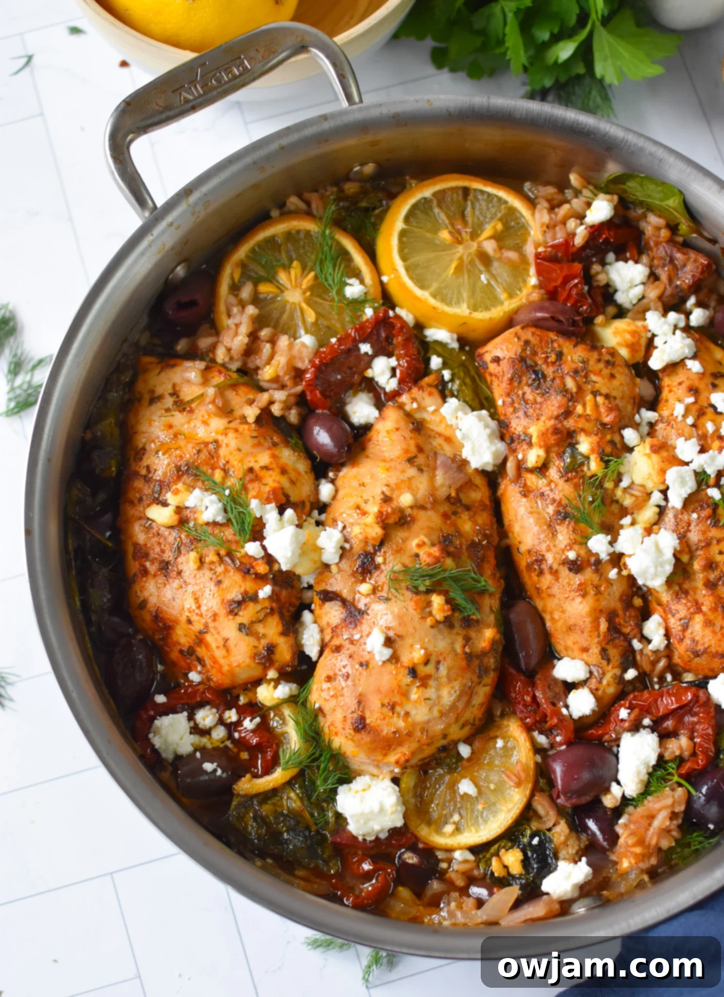 Mediterranean Sun-dried Tomato Chicken Farro Bake 8 Sun-dried Tomato Farro Chicken Bake bubbling in a skillet, fresh out of the oven.