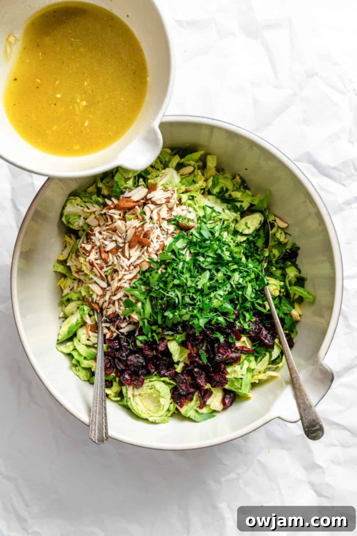Brussels Sprout Slaw dressing going into salad