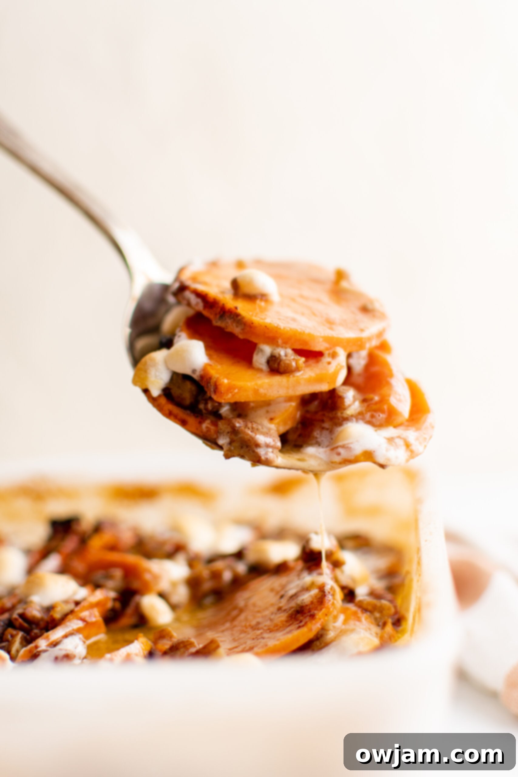 Effortless Sweet Potato Bake 2 Easy Scalloped Sweet Potatoes on a spoon.