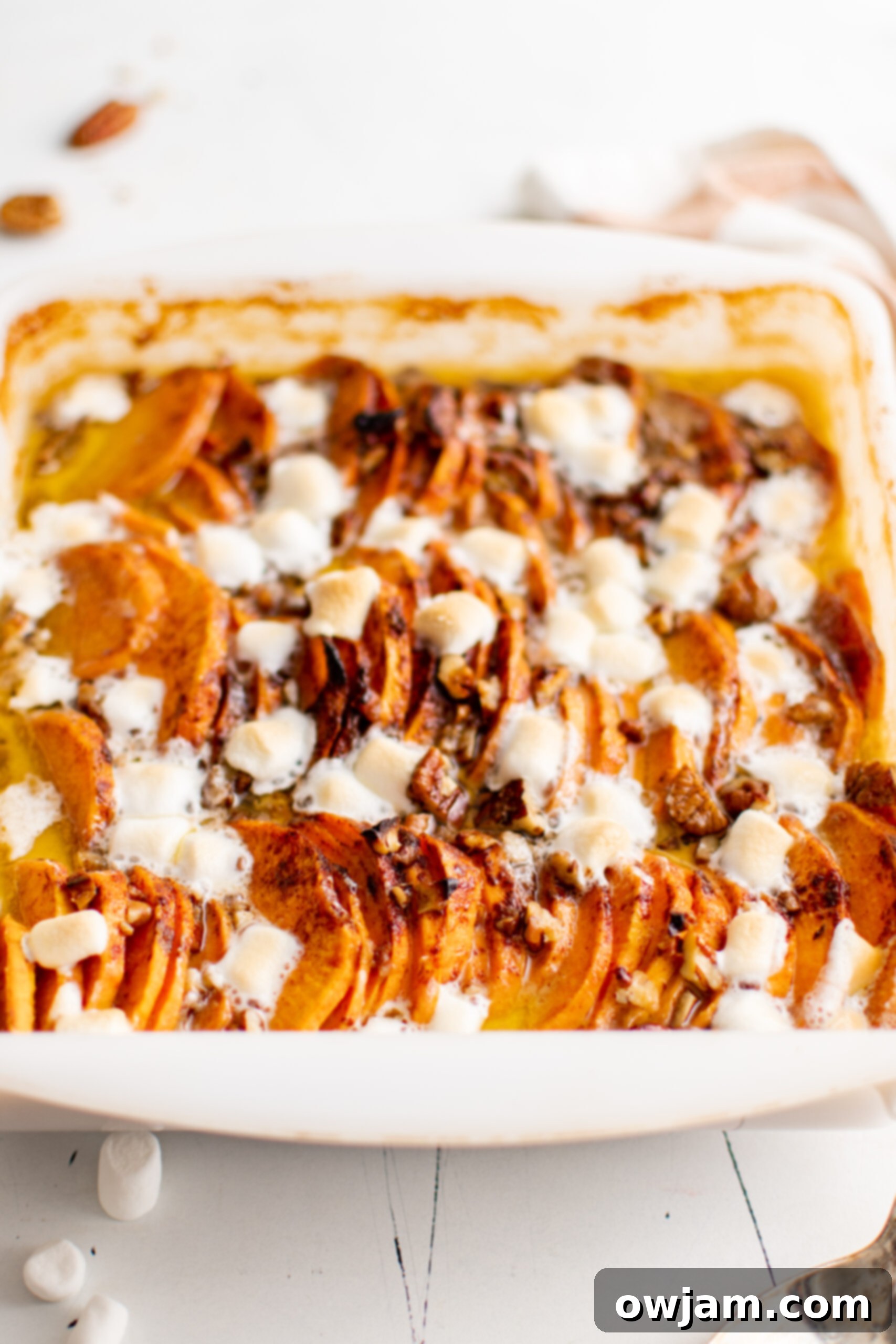 Effortless Sweet Potato Bake 4 Easy Scalloped Sweet Potatoes in a white baking dish.