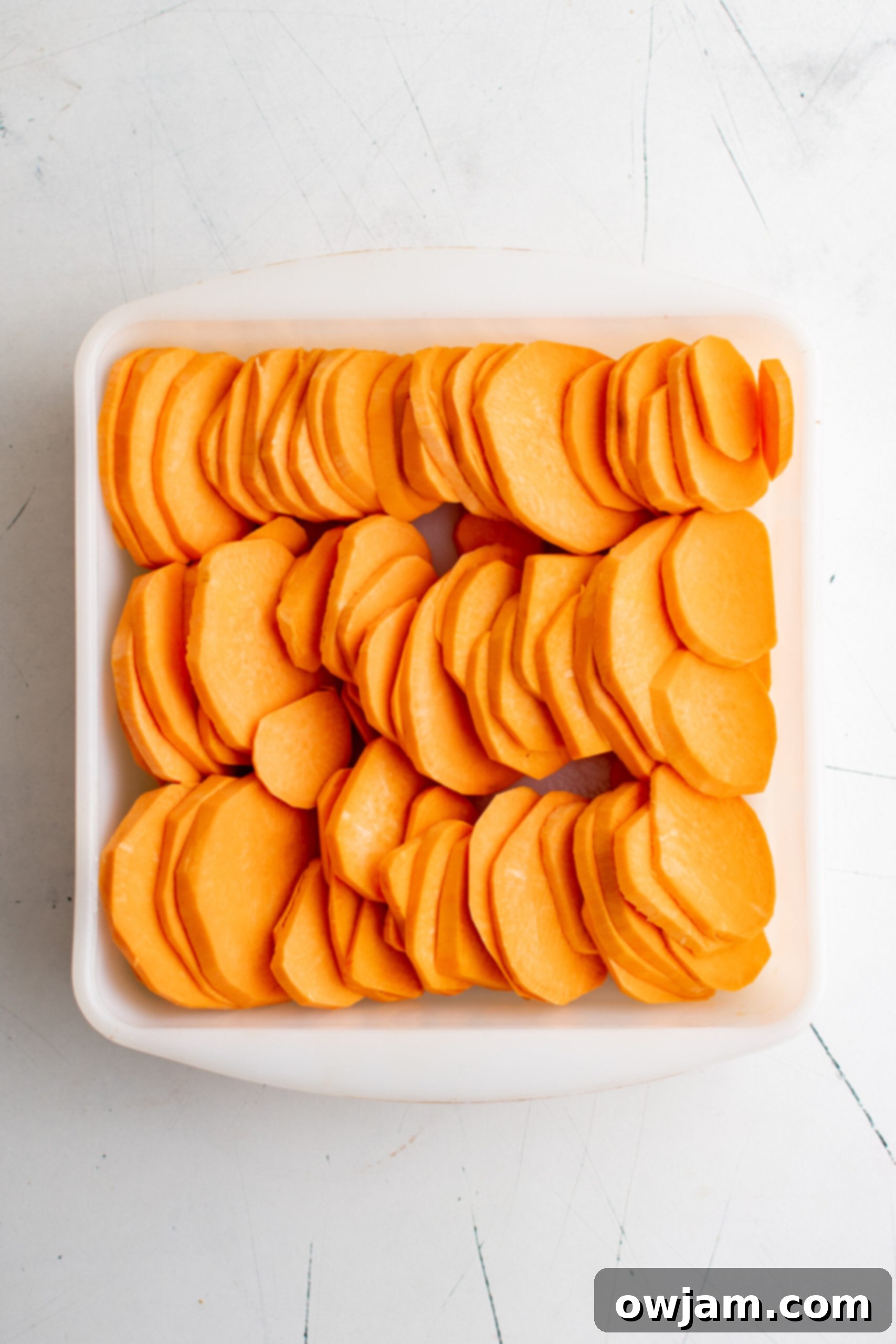 Effortless Sweet Potato Bake 5 Easy Scalloped Sweet Potatoes sweet potatoes in a dish.