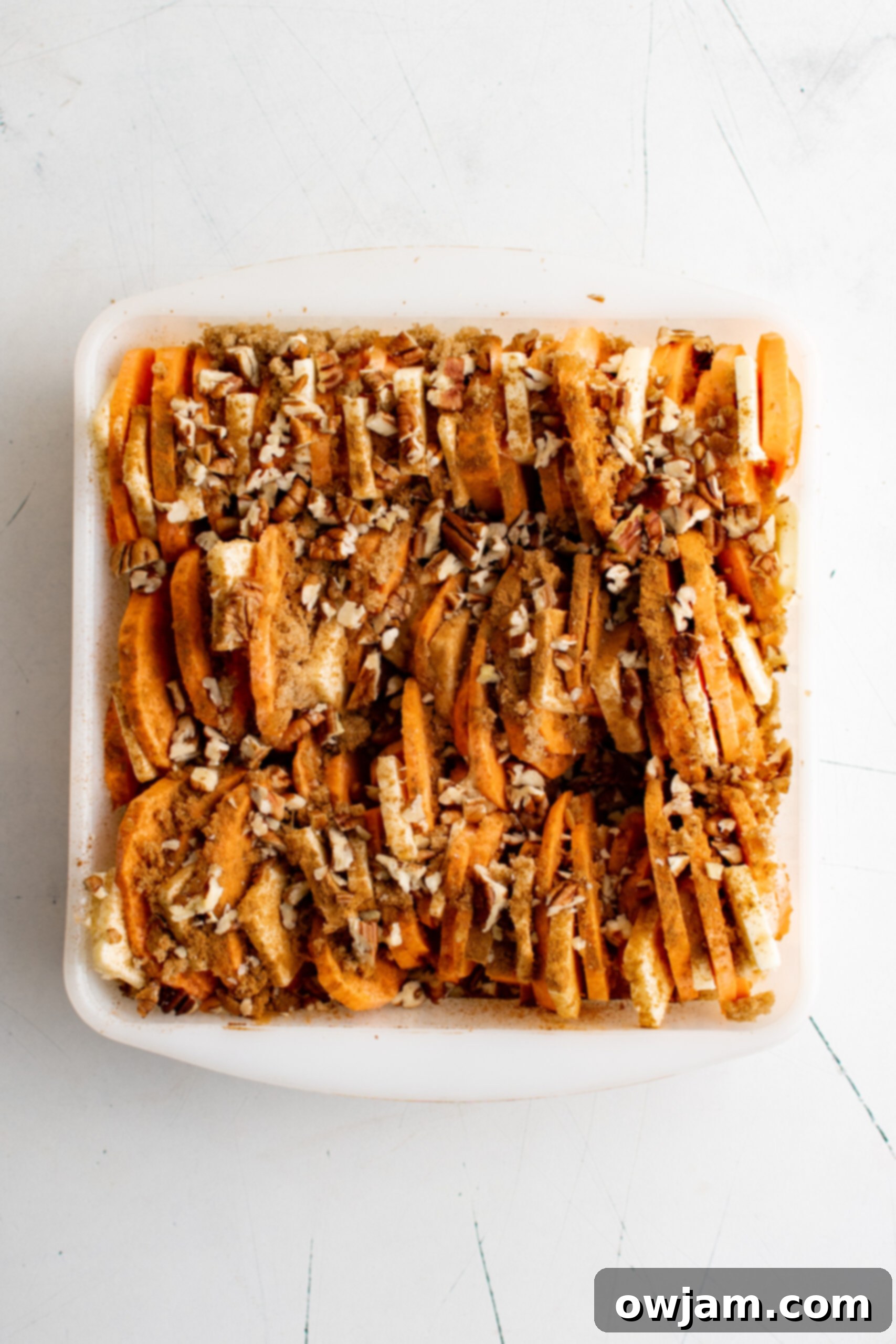 Effortless Sweet Potato Bake 7 Easy Scalloped Sweet Potatoes with pecans.