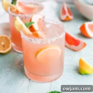 Tangy Grapefruit Paloma 9 Grapefruit Paloma Cocktail in a glass.