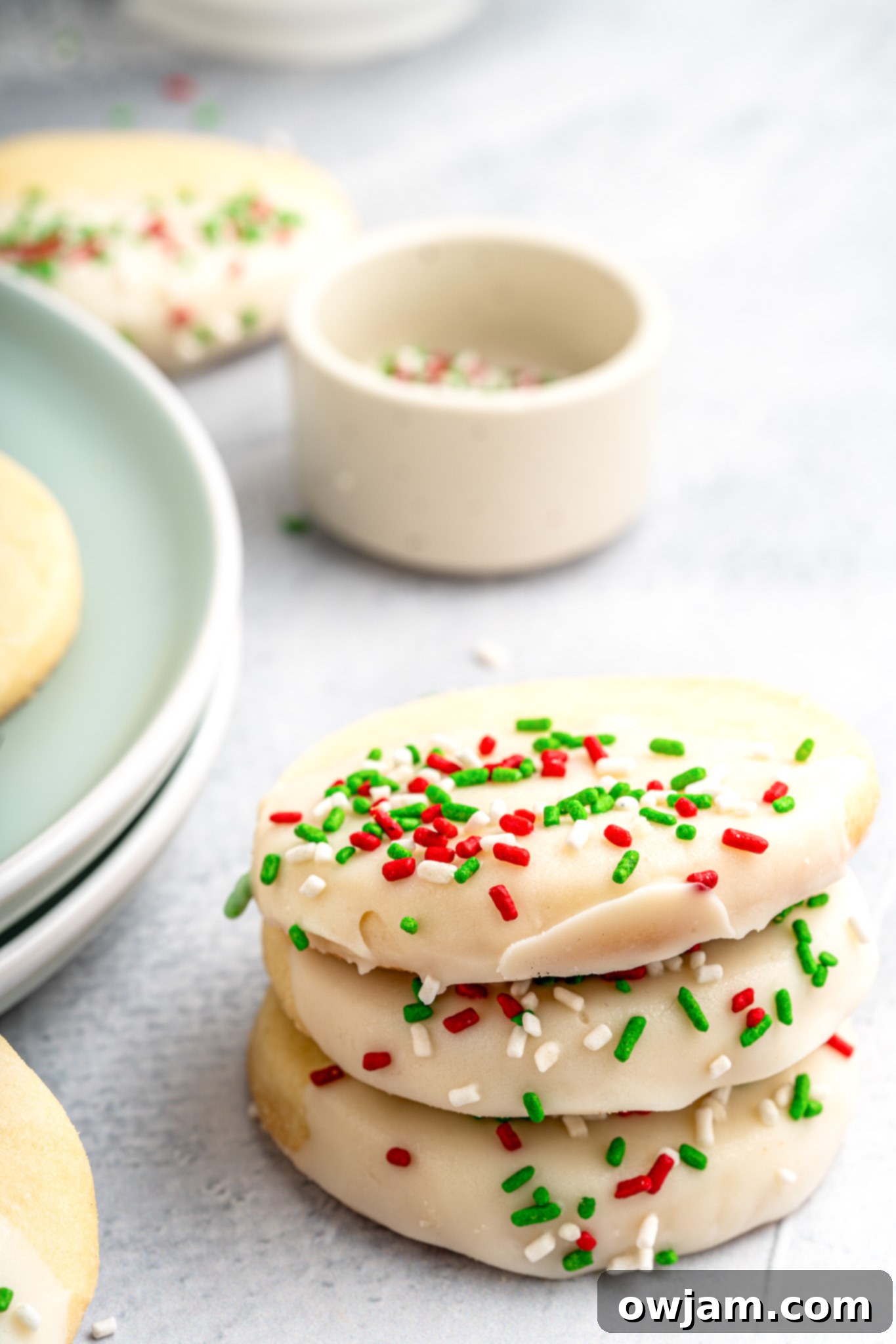 A stack of perfectly baked and decorated Christmas Shortbread Cookies, showcasing their delicate texture and festive appeal.