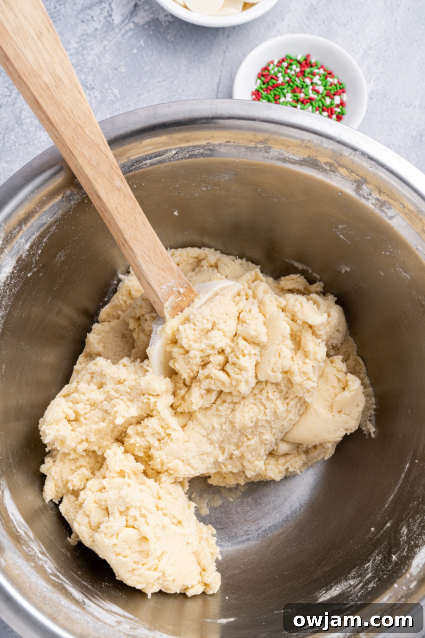 Christmas Shortbread Cookies dough in a bowl, ready for chilling and rolling.