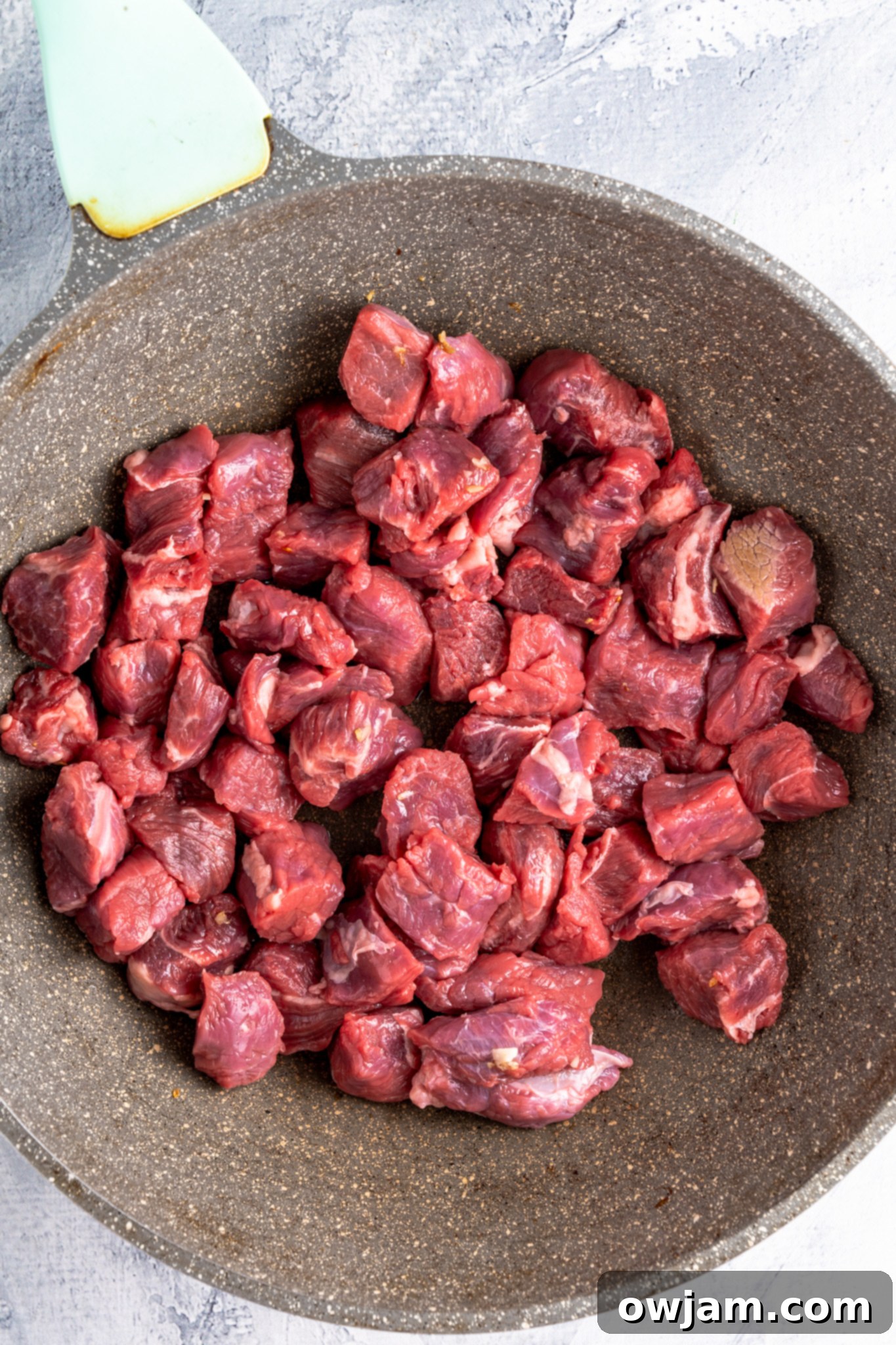 Crock Pot Beef Stew meat in a skillet.