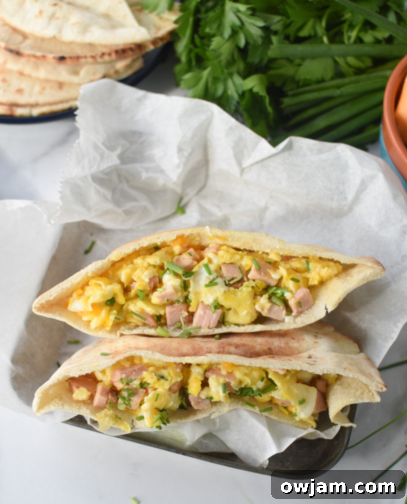 Finished Breakfast Pita Recipe presented neatly in a metal tin, ready for serving or on-the-go.