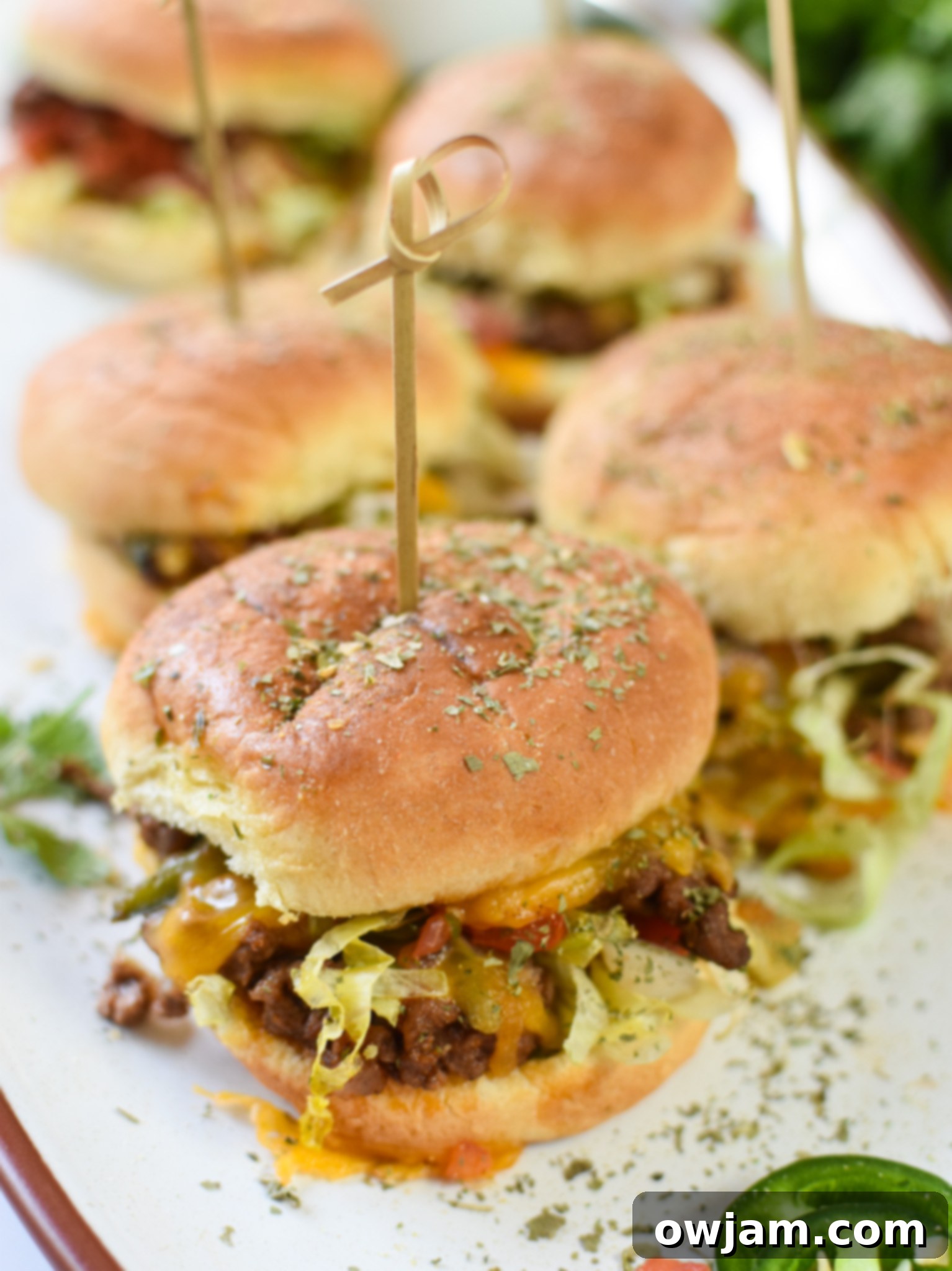 Taco Beef Sliders on a white platter.