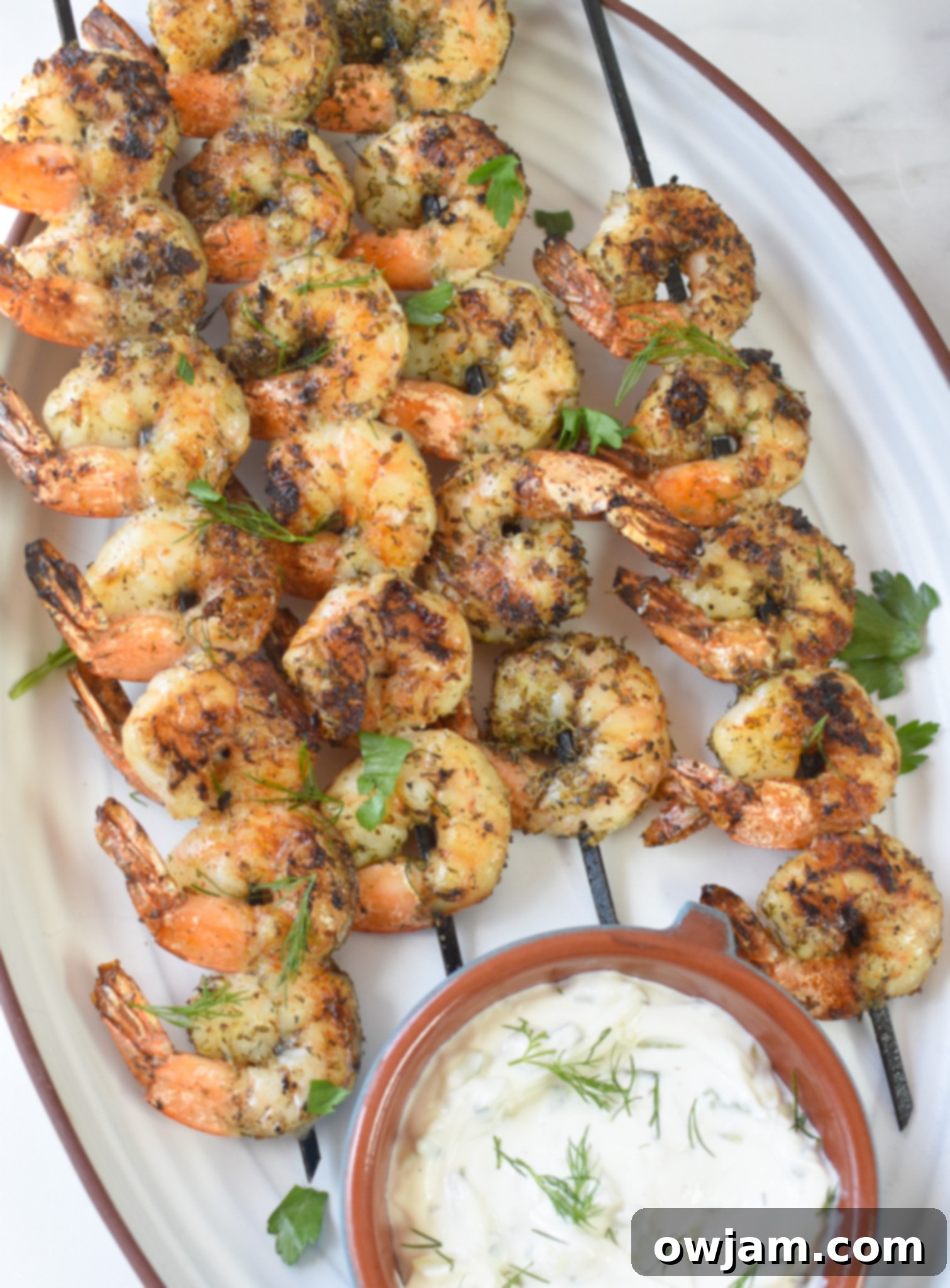 Zesty Greek Shrimp Marinade 2 Greek Shrimp Marinade on white platter.