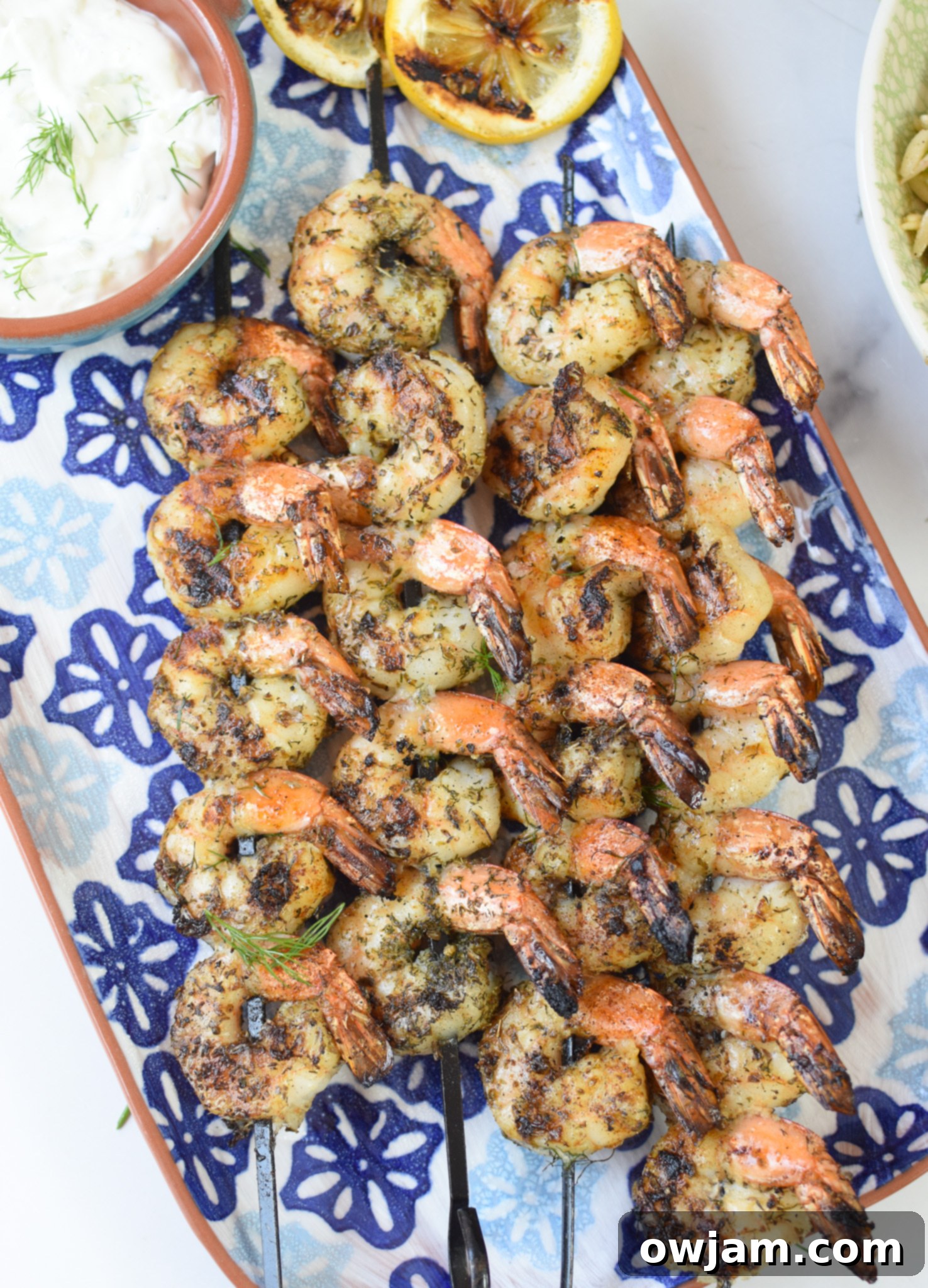 Zesty Greek Shrimp Marinade 6 Greek Shrimp Marinade on a blue plate.