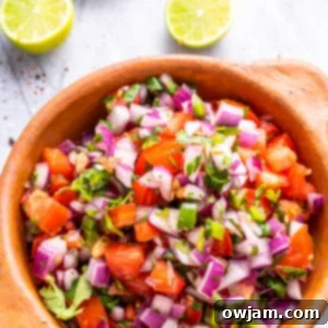 Fresh Homemade Pico de Gallo 9 Homemade Pico de Gallo in a tan colored bowl.