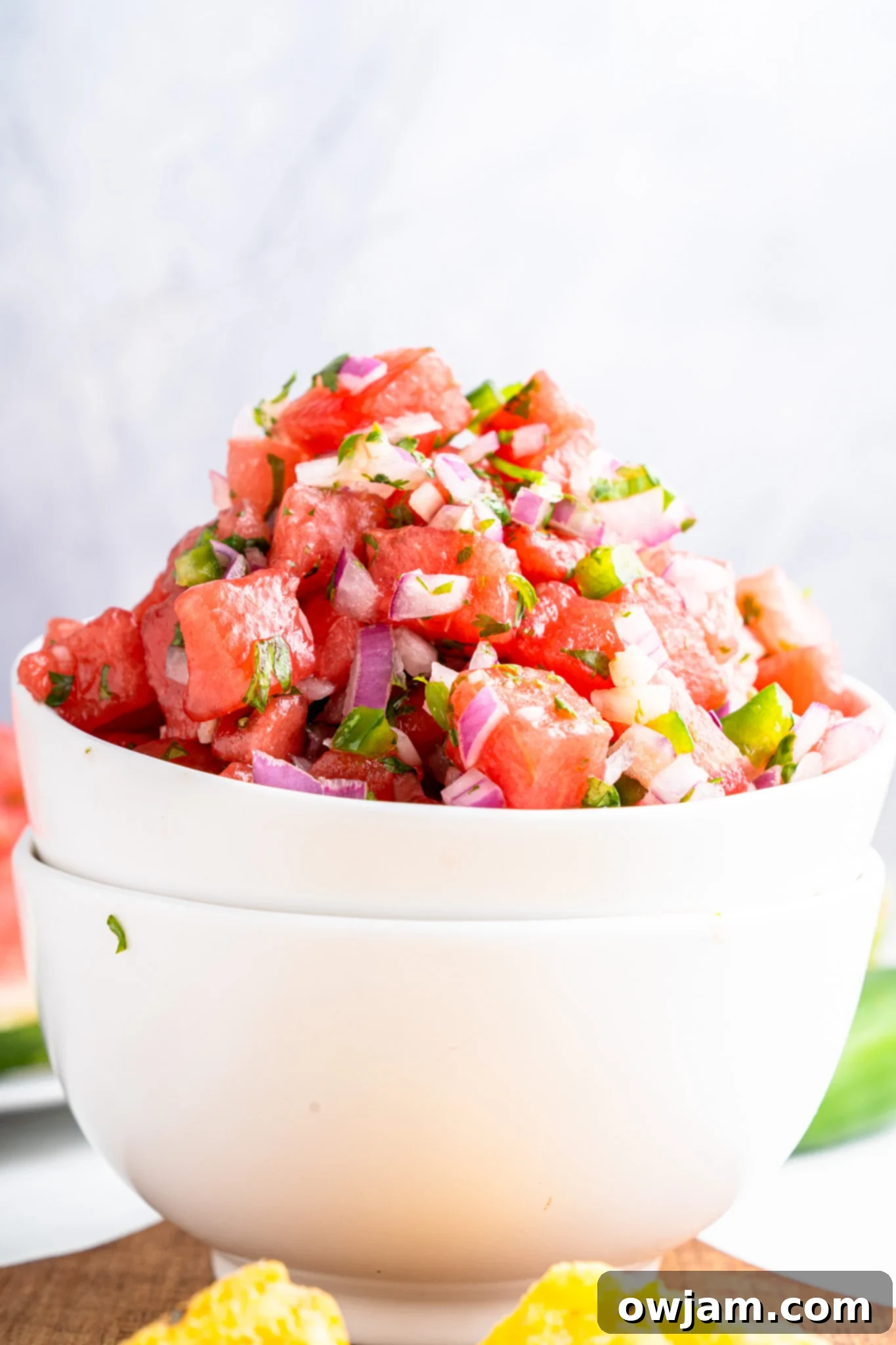 Effortless Watermelon Salsa 2 A vibrant bowl of Easy Watermelon Salsa, showcasing diced watermelon, red onion, jalapeño, and cilantro, ready to be served.
