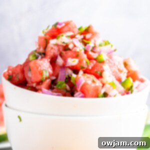 Effortless Watermelon Salsa 9 Easy Watermelon Salsa in a white bowl, a refreshing side dish.