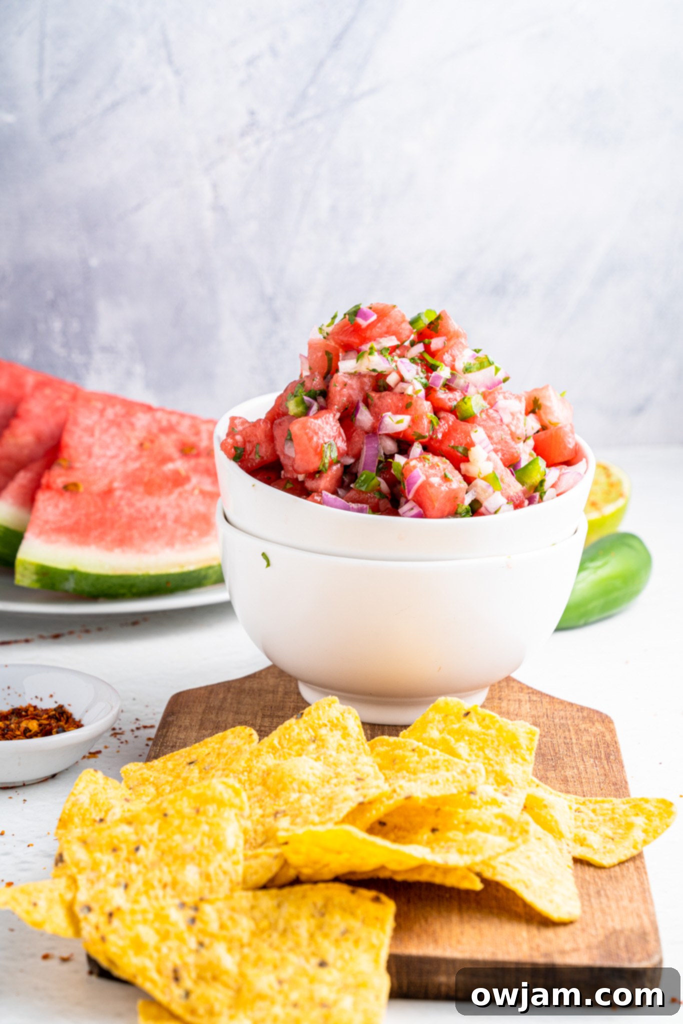 Effortless Watermelon Salsa 6 A bowl of Easy Watermelon Salsa served with tortilla chips, inviting a refreshing dip.