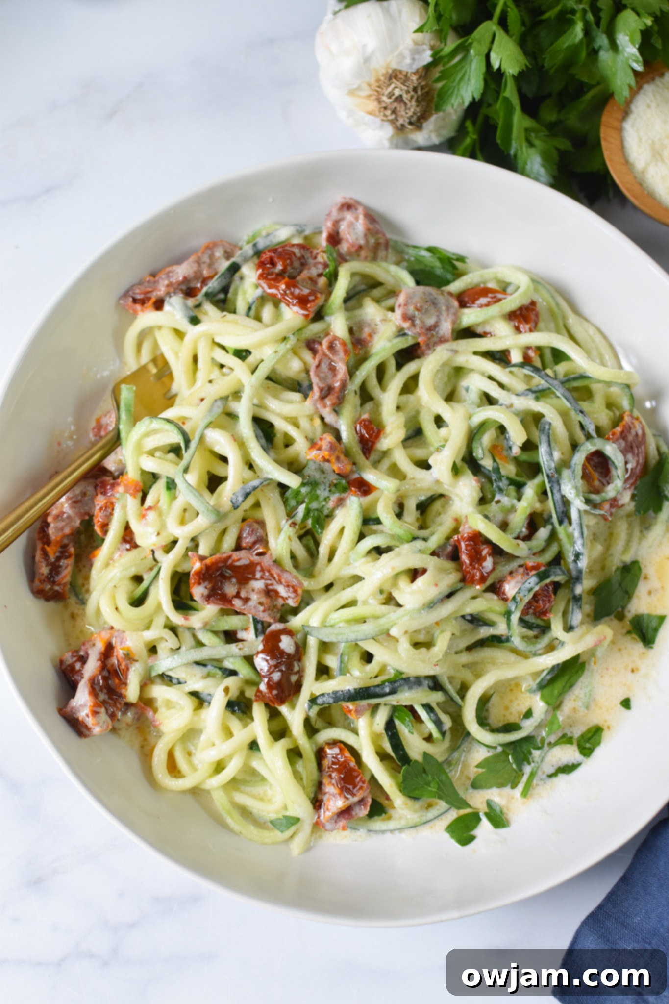 Alfredo Zoodles Recipe in a white bowl. 