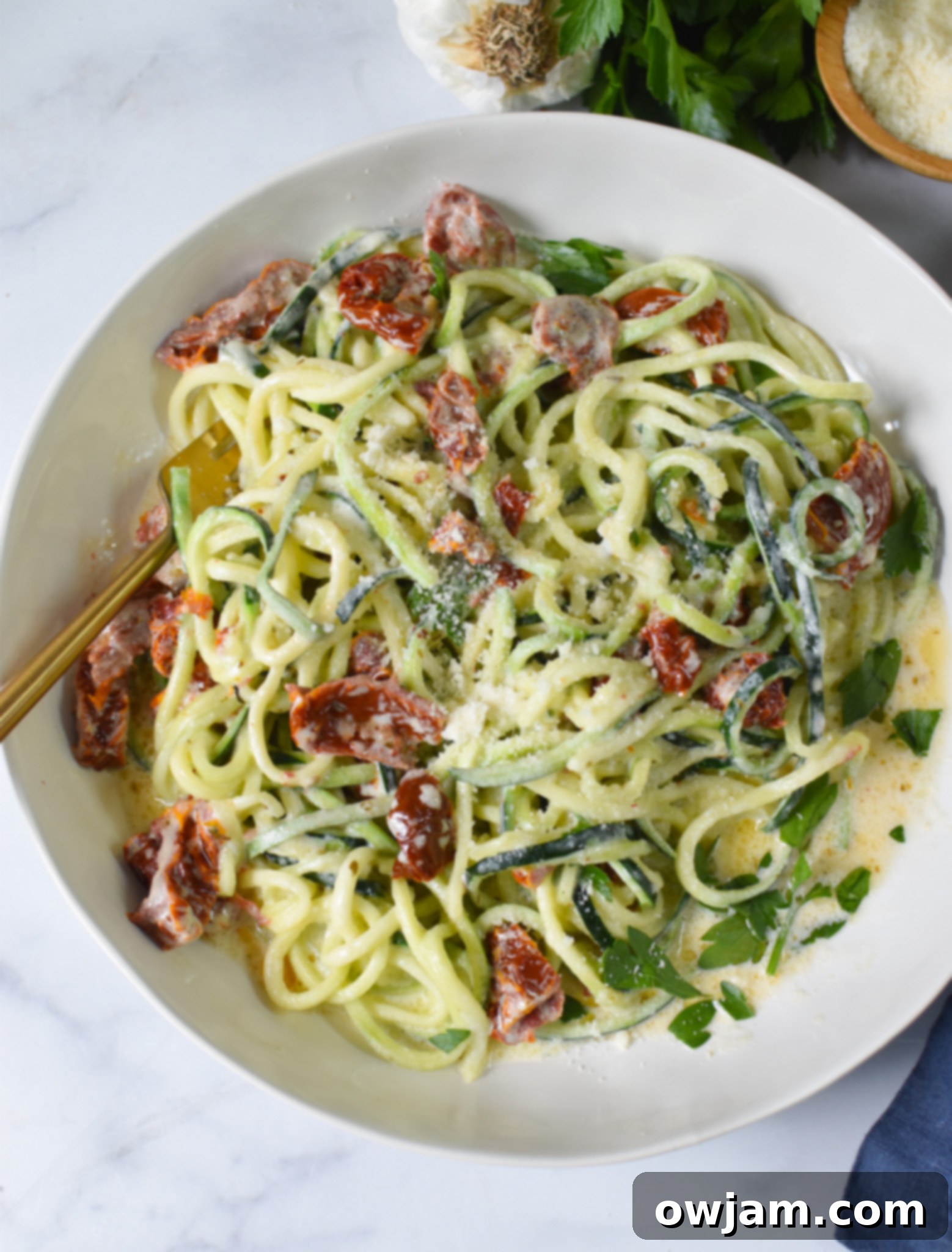 Alfredo Zoodles Recipe in a white bowl. 