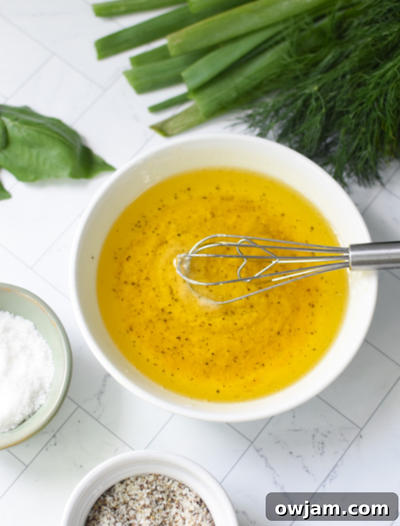 Dressing ingredients for No Mayo Potato Salad, including olive oil, lemon, and vinegar.