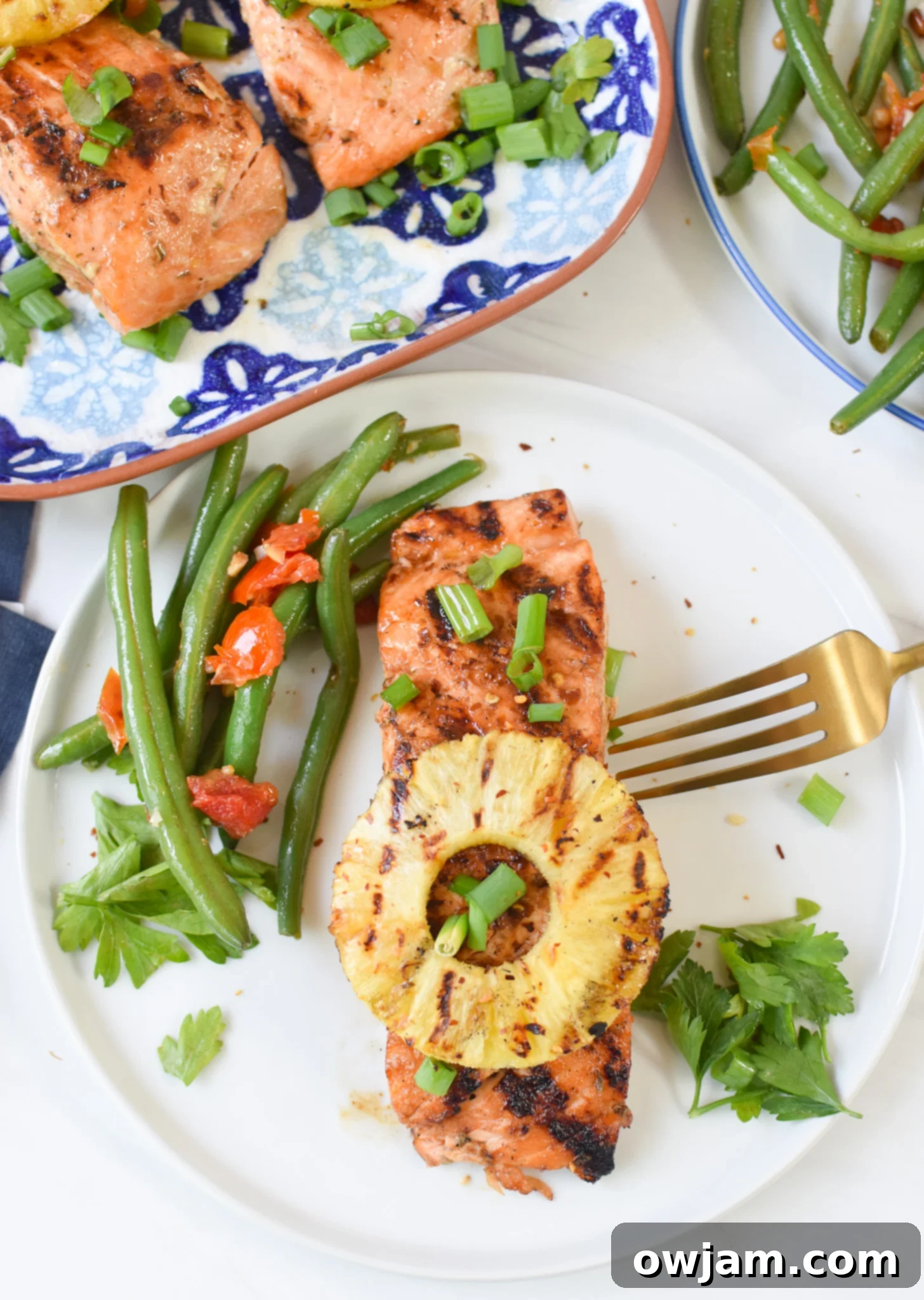 Aloha Grilled Salmon 5 Hawaiian Grilled Salmon on a white plate.