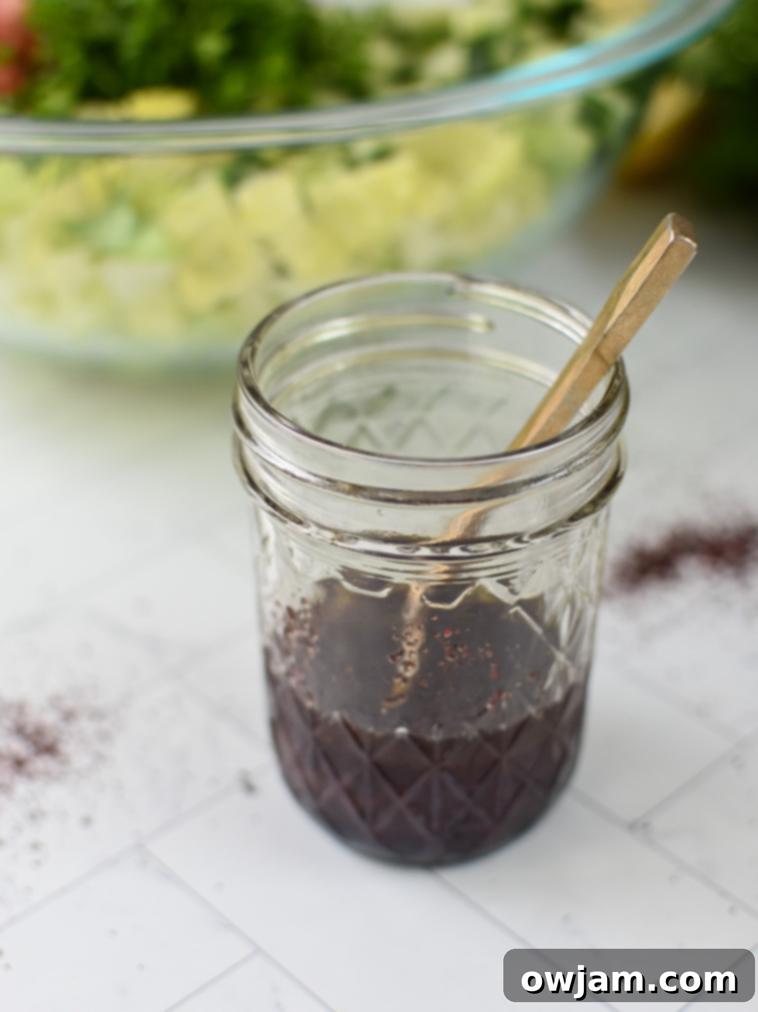 Simple Arabic Salad 7 Easy Arabic Salad dressing in a glass mason jar, highlighting its rich color and smooth texture.