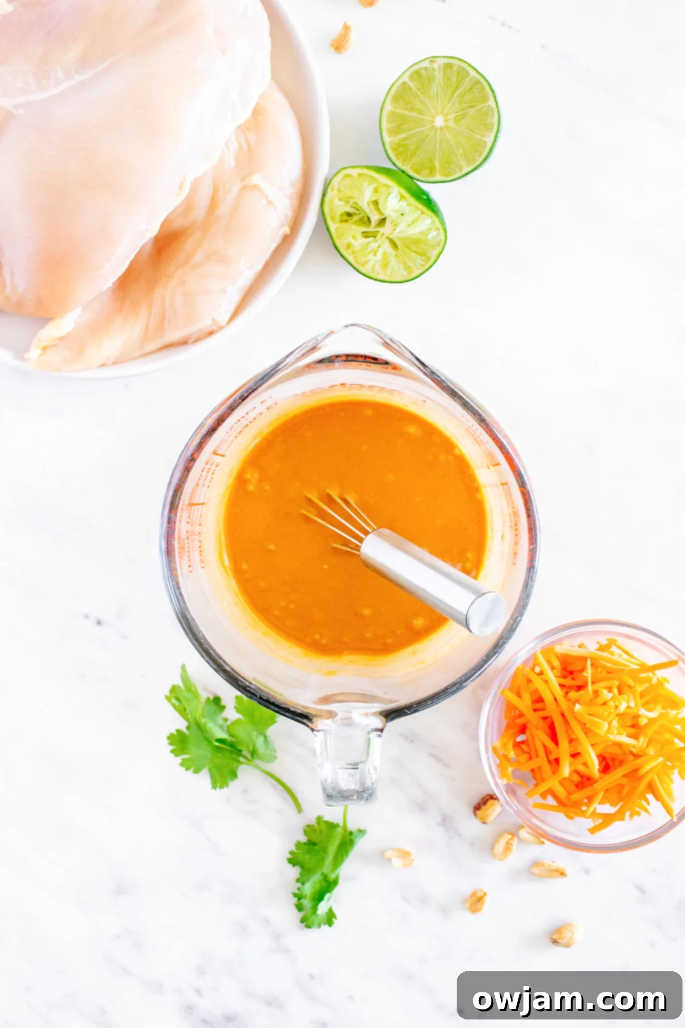Thai Chicken Noodle Salad chicken with sauce. Chicken marinating in a flavorful Thai sauce.