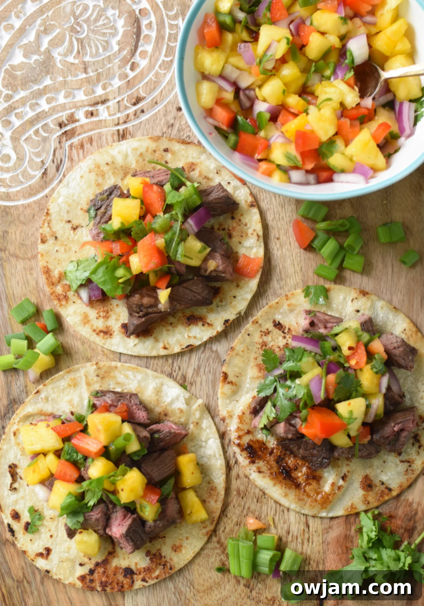 Balsamic Marinated Skirt Steak tacos on a cutting board. 