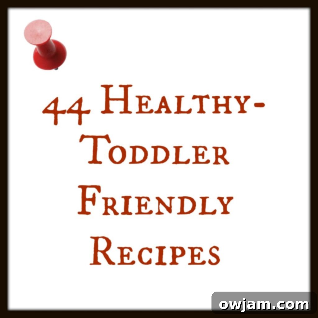 A vibrant collection of 44 healthy toddler-friendly meals arranged on a wooden table, featuring colorful fruits, vegetables, pasta, and protein sources, designed for picky eaters.