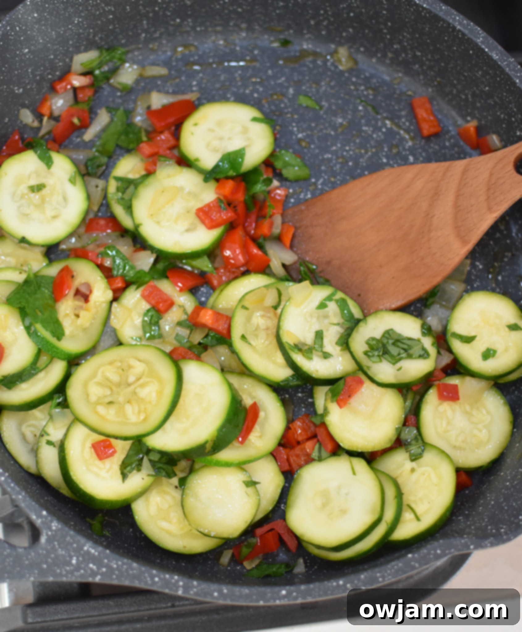 Savory Zucchini Frittata 9 Sautéed vegetables in a skillet for the Zucchini Frittata Recipe.