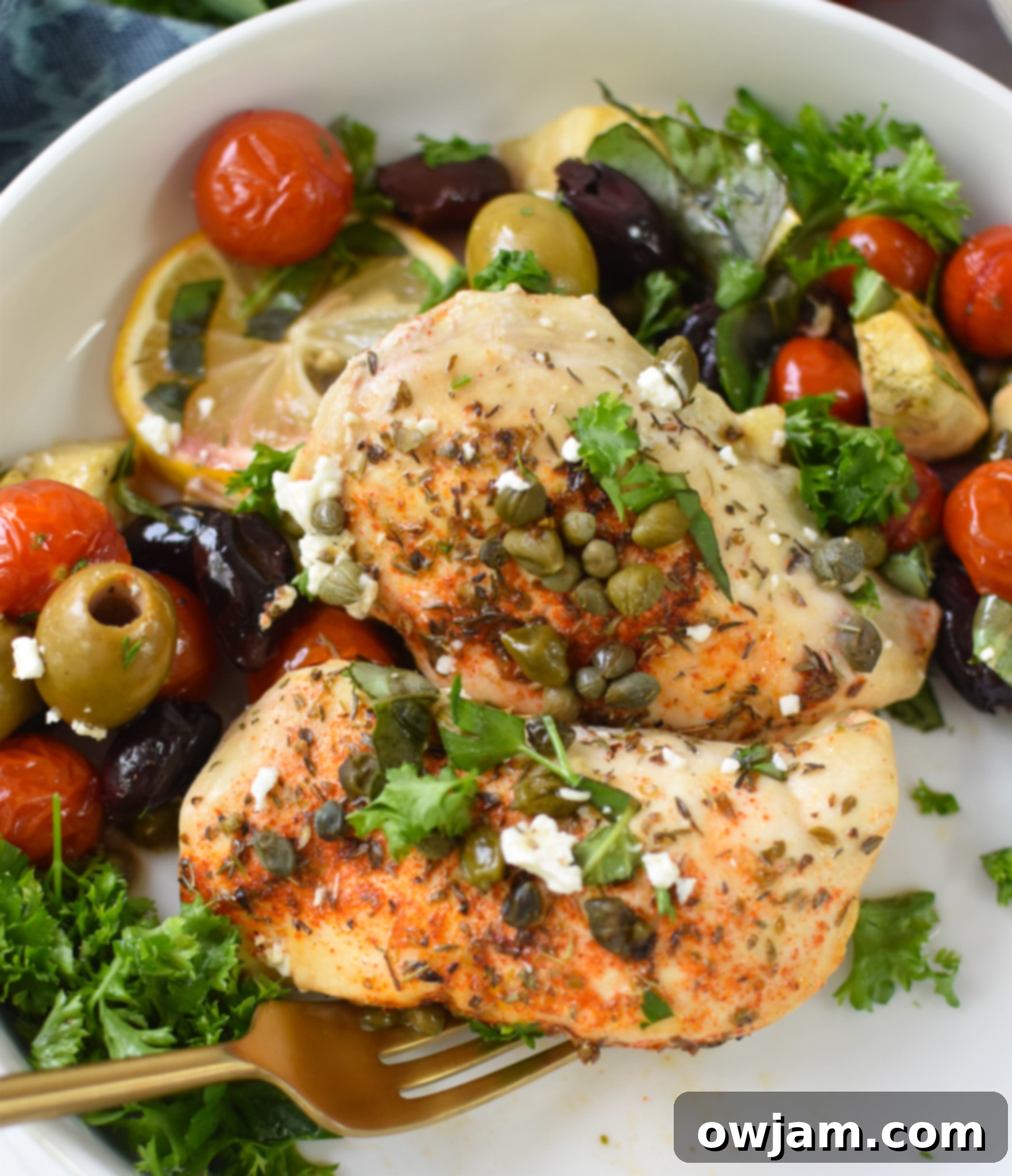 Easy Mediterranean Chicken Skillet 5 Mediterranean Skillet Chicken, fresh out of the oven, garnished with vibrant fresh herbs.