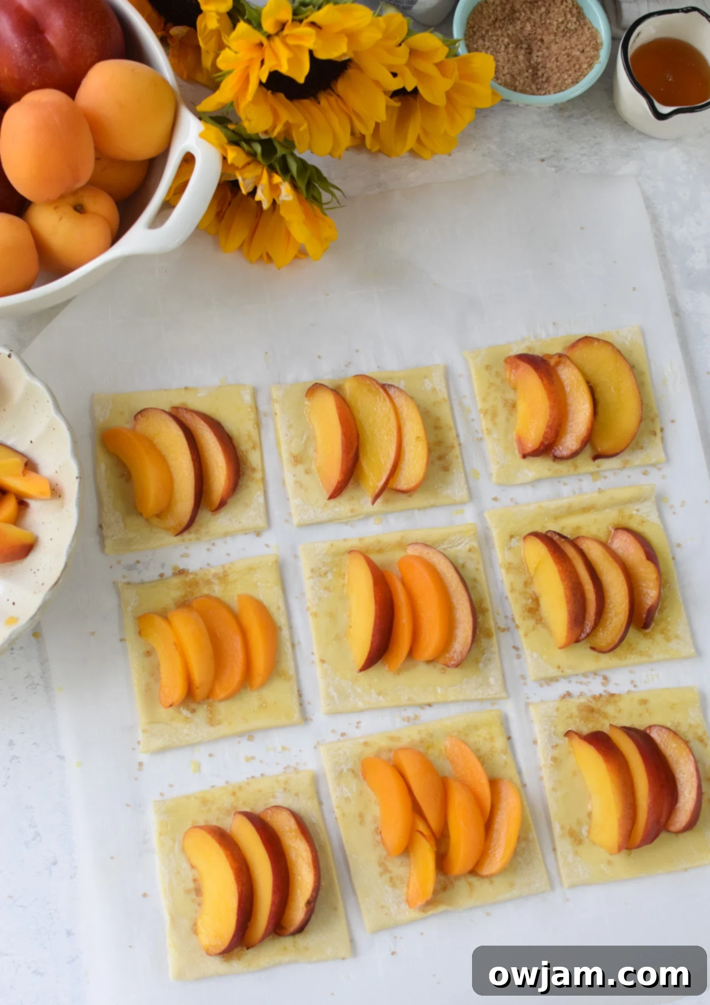 Easy Peach Tart peaches on the puff pastry before baking.