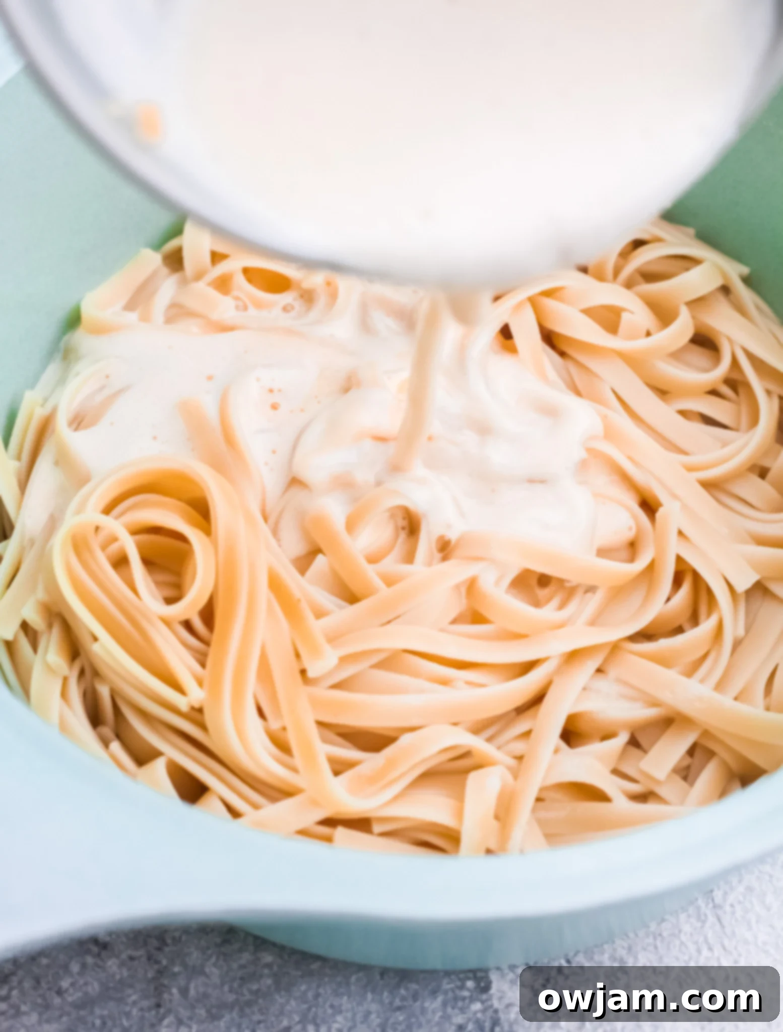 Prosciutto Pasta sauce mixture in a small pot, showing the creamy consistency.