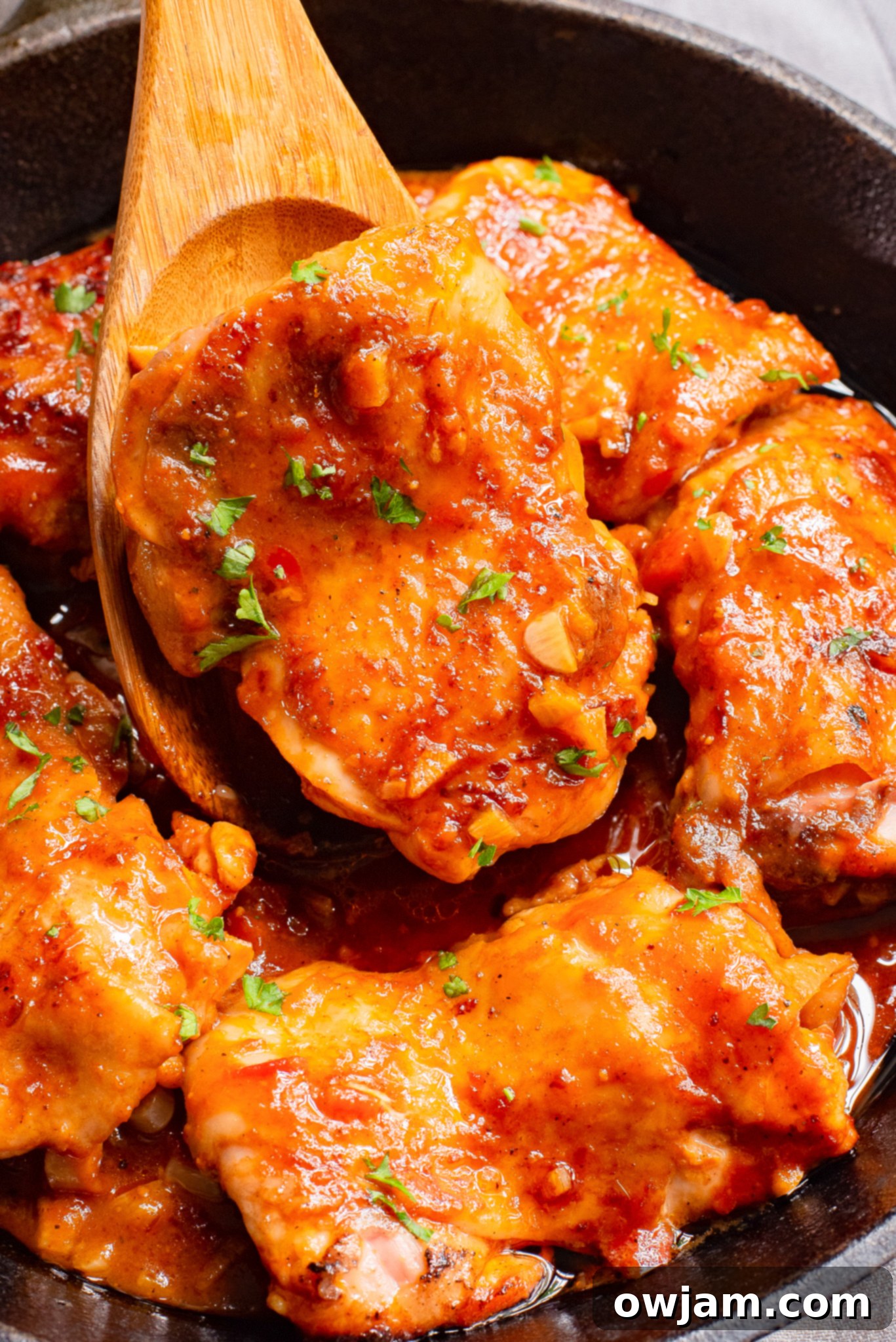 Spicy Harissa Chicken 3 Harissa Chicken Recipe with a spoon.
