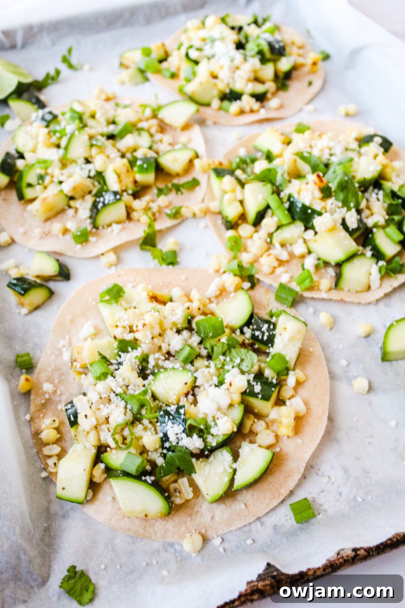 Zesty Zucchini Tacos 7 Several Easy Zucchini Tacos arranged on a baking sheet, ready to be served.